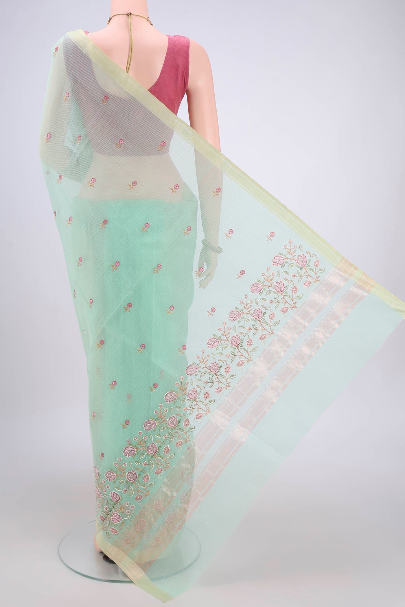 Flat view of Mint Green Blended Kota Cotton Saree with Embroidery on the body and Zari Border. 