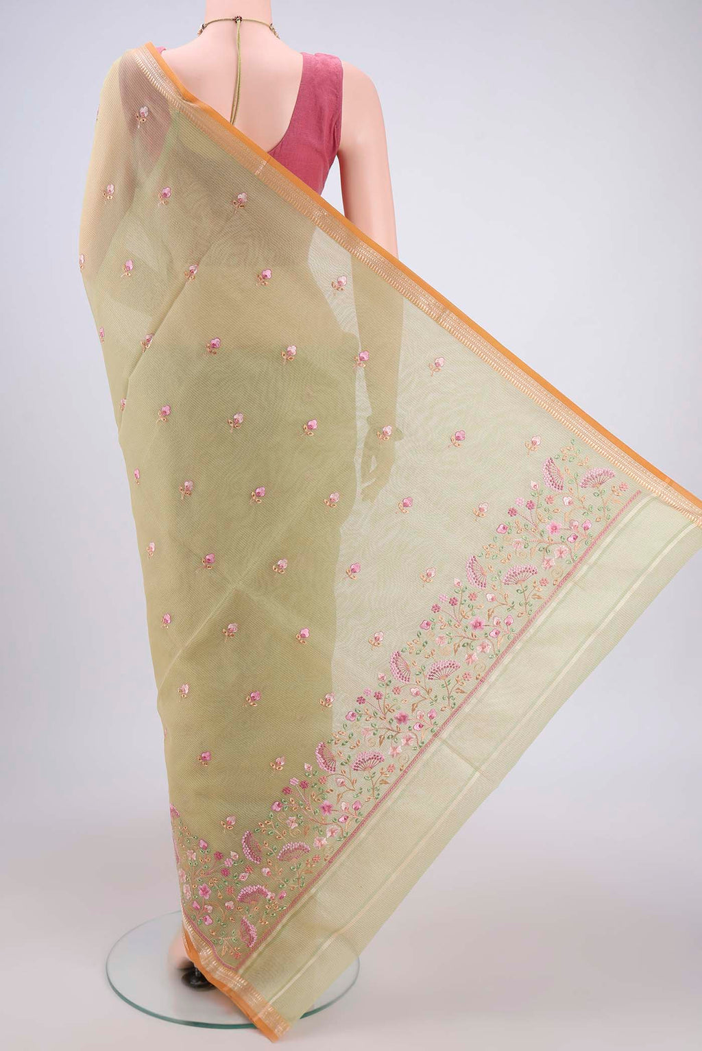 Flat view of Light Green Blended Kota Cotton Saree with Embroidery on the body and Zari Border. 