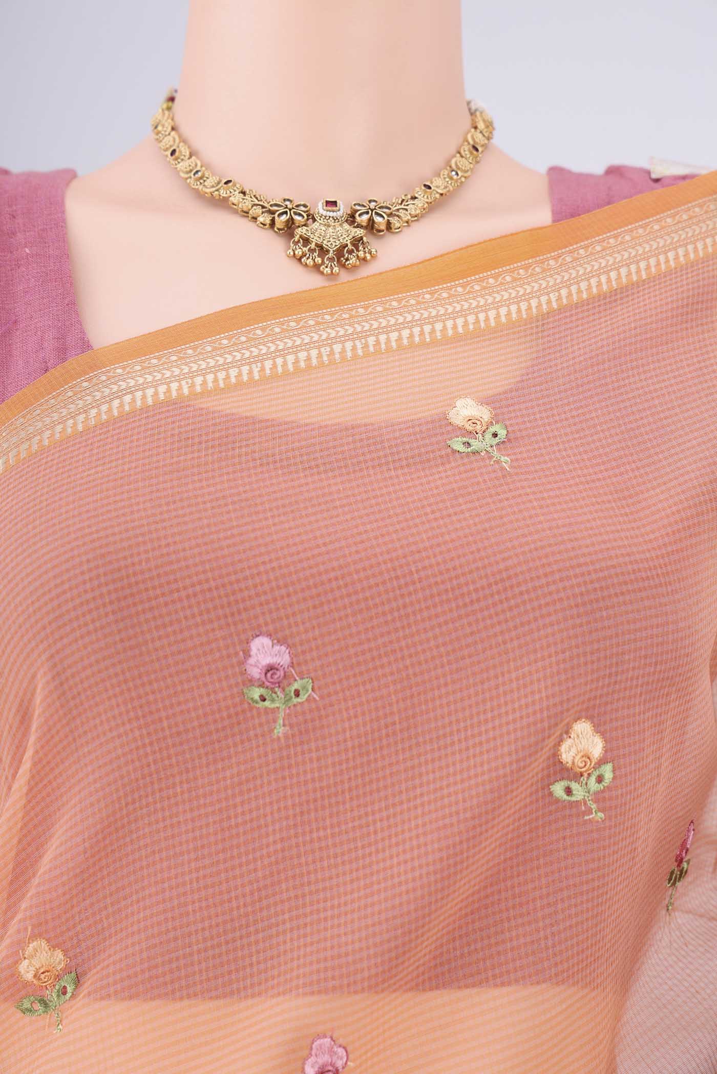 Border image of Orange Blended Kota Cotton Saree with Embroidery on the body and Thread Border. 