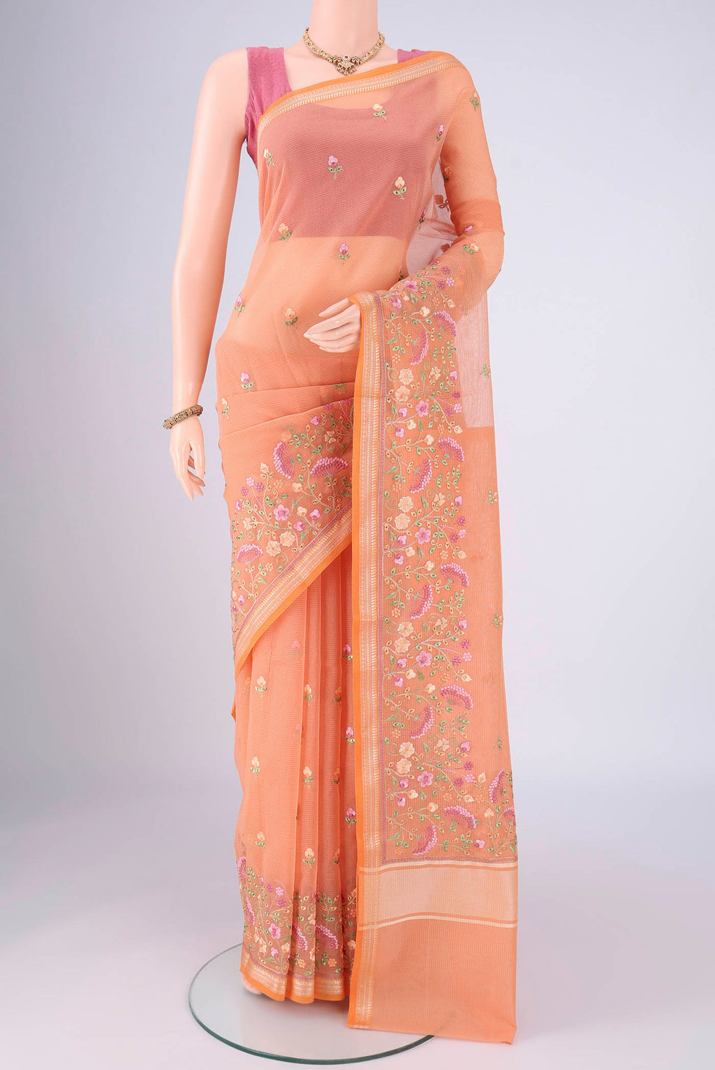 Orange Blended Kota Cotton Saree with Embroidery on the body and Thread Border.  displayed on a mannequin