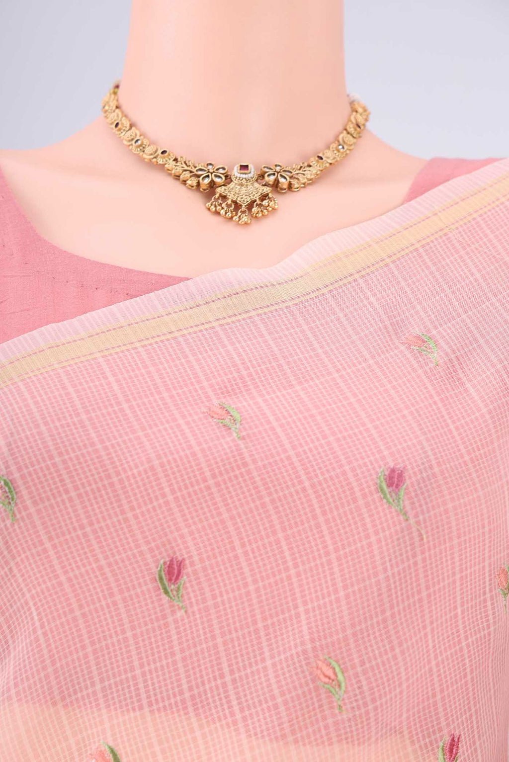 Border image of Peach Blended Kota Cotton Saree with Embroidery on the body and Checks Border. 