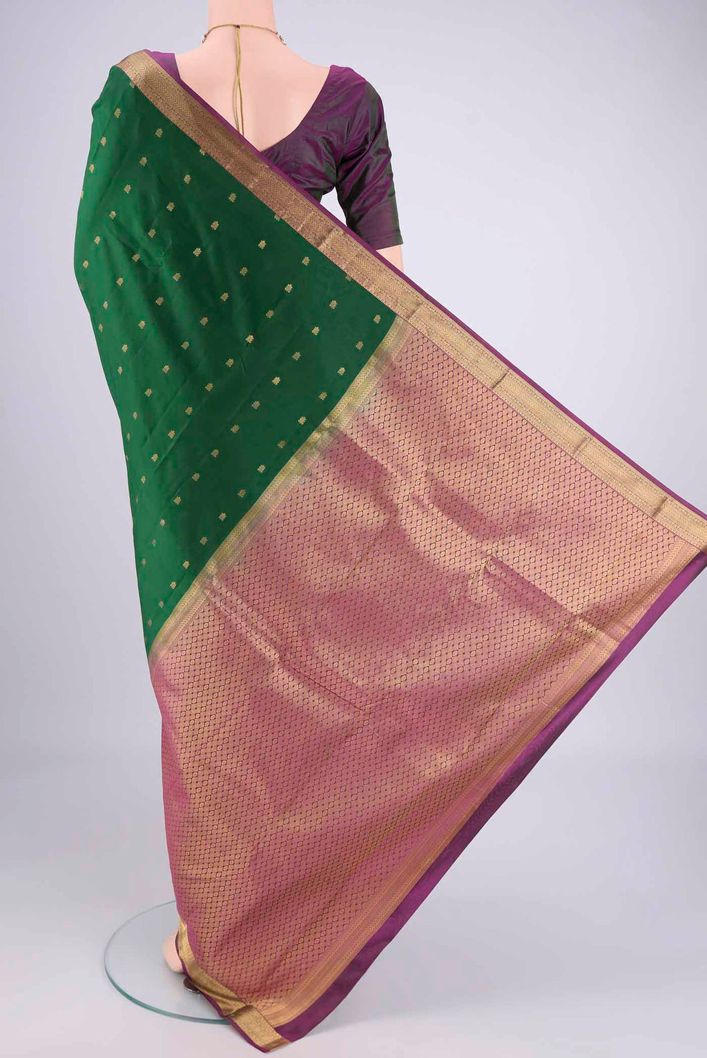 Flat view of Purple Kanjivaram Silk Saree with Zari Butta on the body and Zari Border. 
