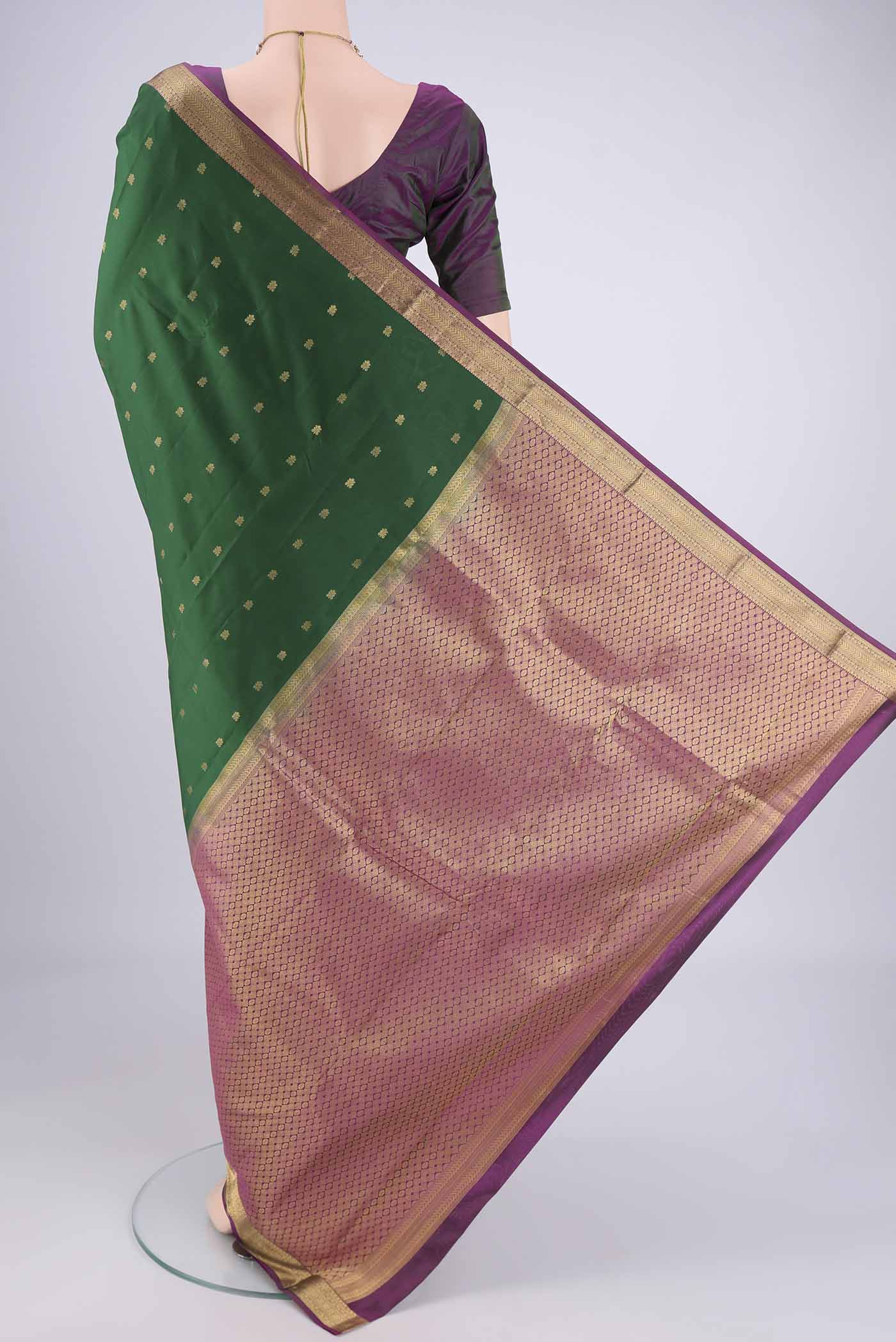 Flat view of Purple Kanjivaram Silk Saree with Zari Butta on the body and Zari Border. 