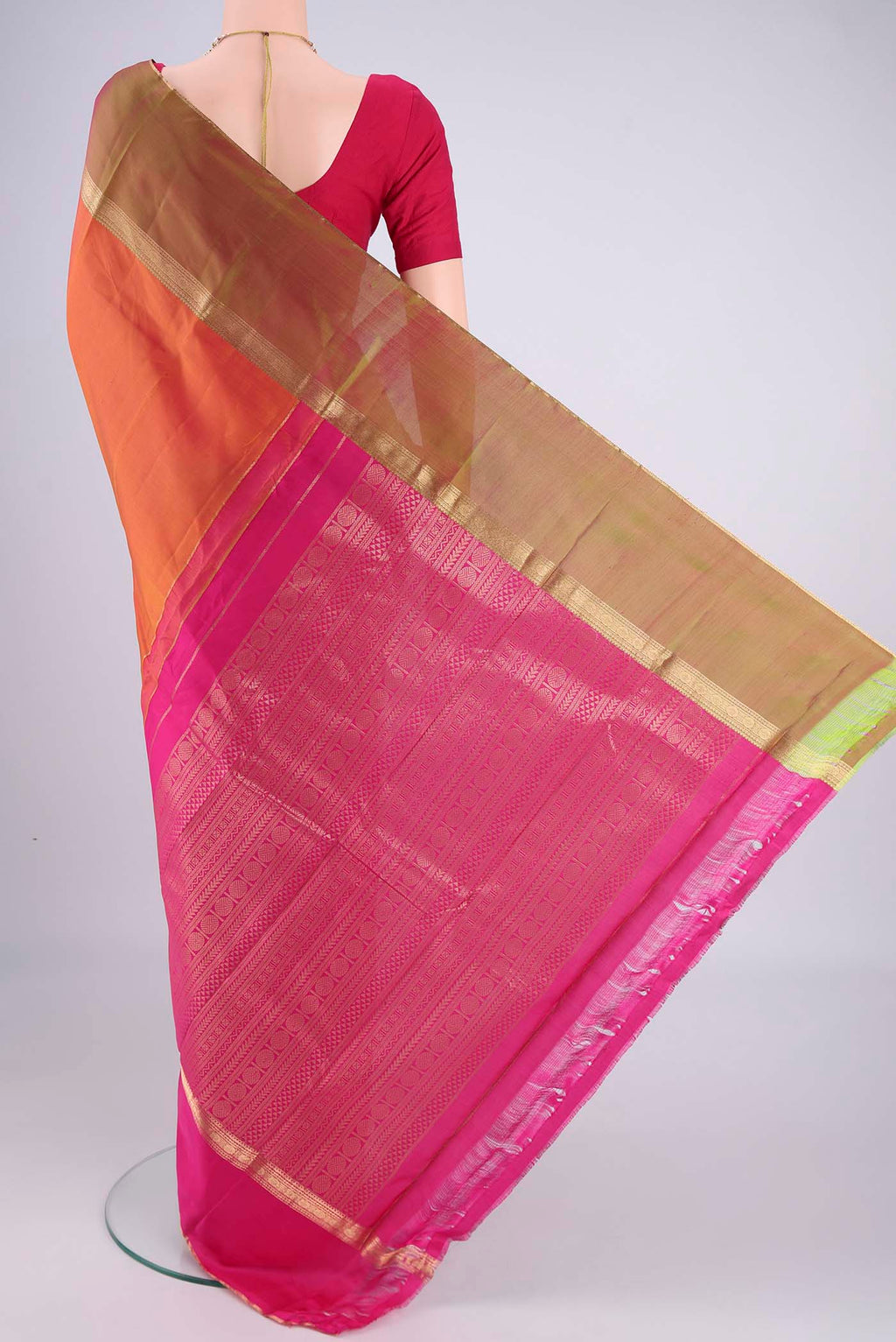 Flat view of Brick Orange Dual Tone Kanchipuram Silk Saree with Zari Butta on the body and Ganga Jamuna Border. 