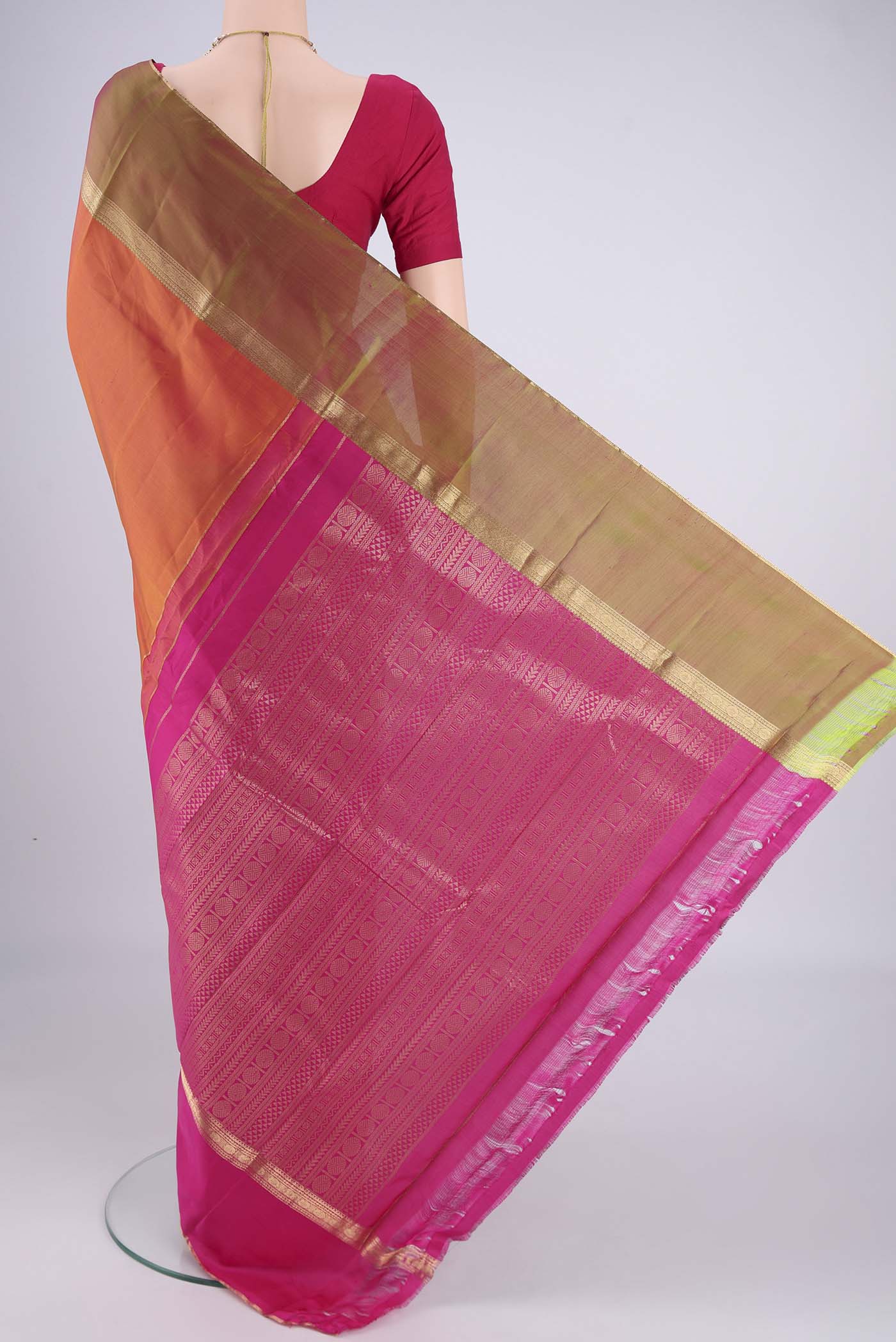 Flat view of Brick Orange Dual Tone Kanchipuram Silk Saree with Zari Butta on the body and Ganga Jamuna Border. 
