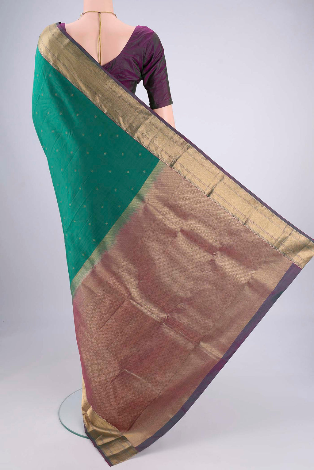 Flat view of Sea Green Kanchipuram Silk Saree with Zari Butta on the body and Zari Border. 