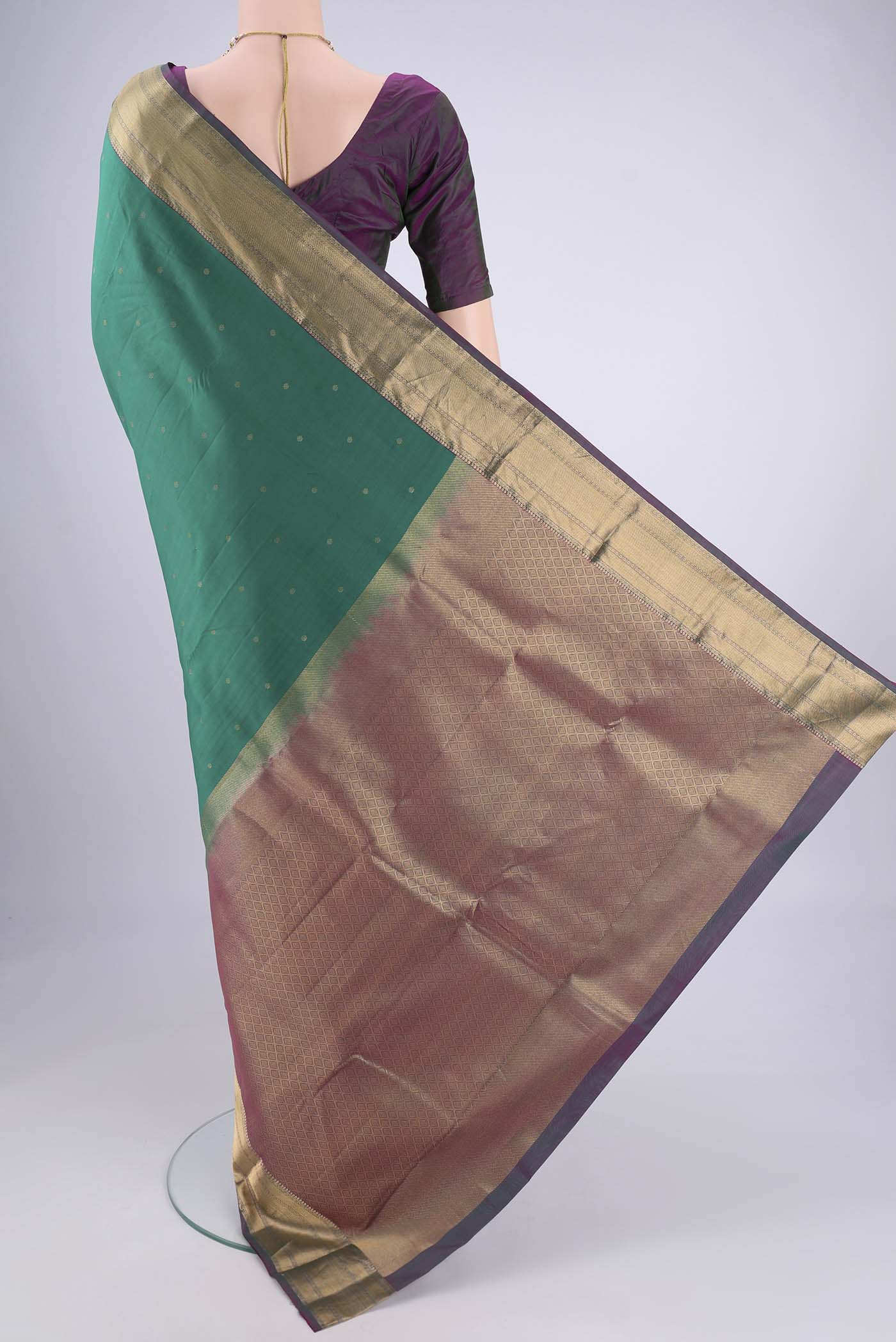 Flat view of Sea Green Kanchipuram Silk Saree with Zari Butta on the body and Zari Border. 