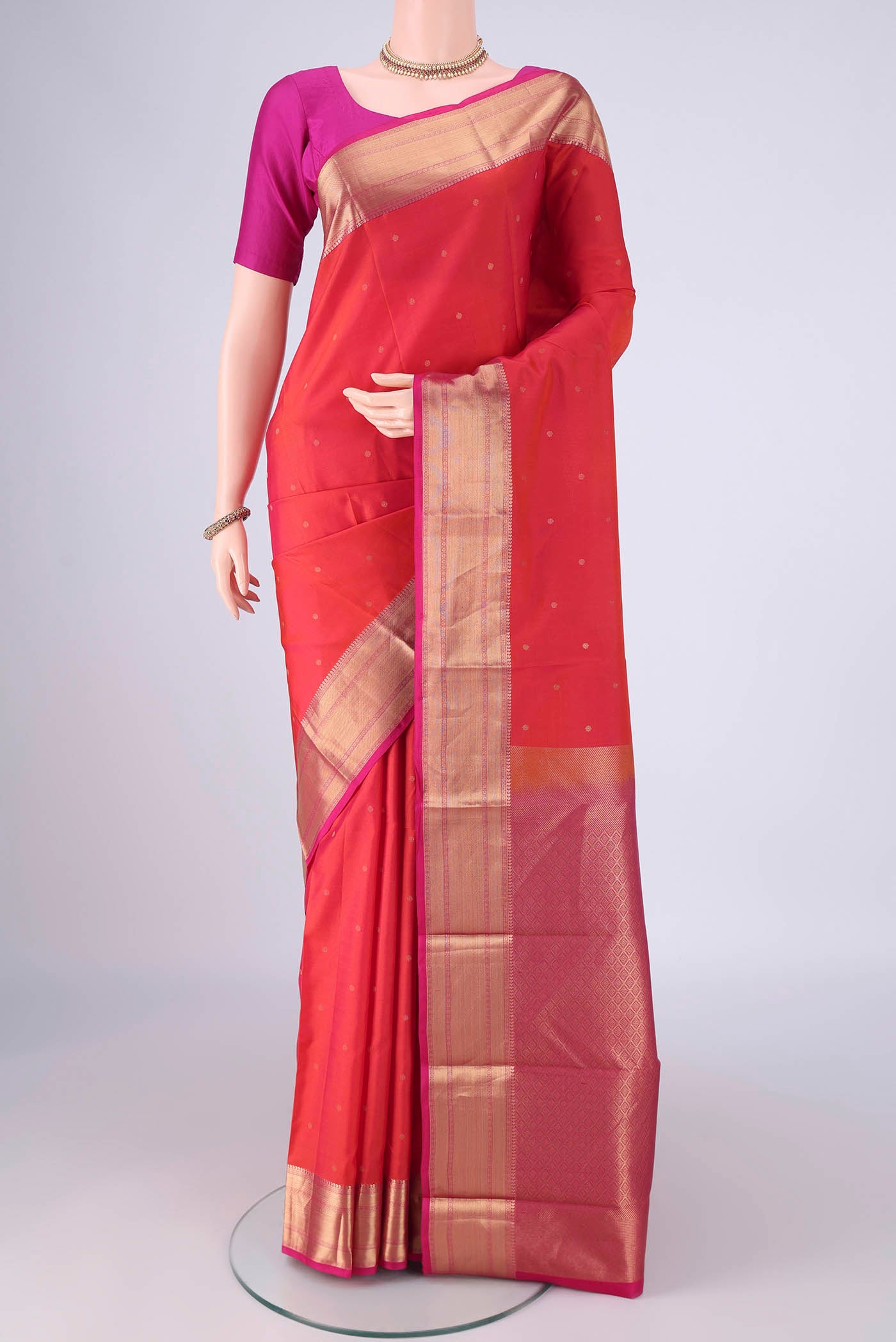 Dark Pink Dual Tone Kanchipuram Silk Saree with Plain Body and Zari Border.  displayed on a mannequin
