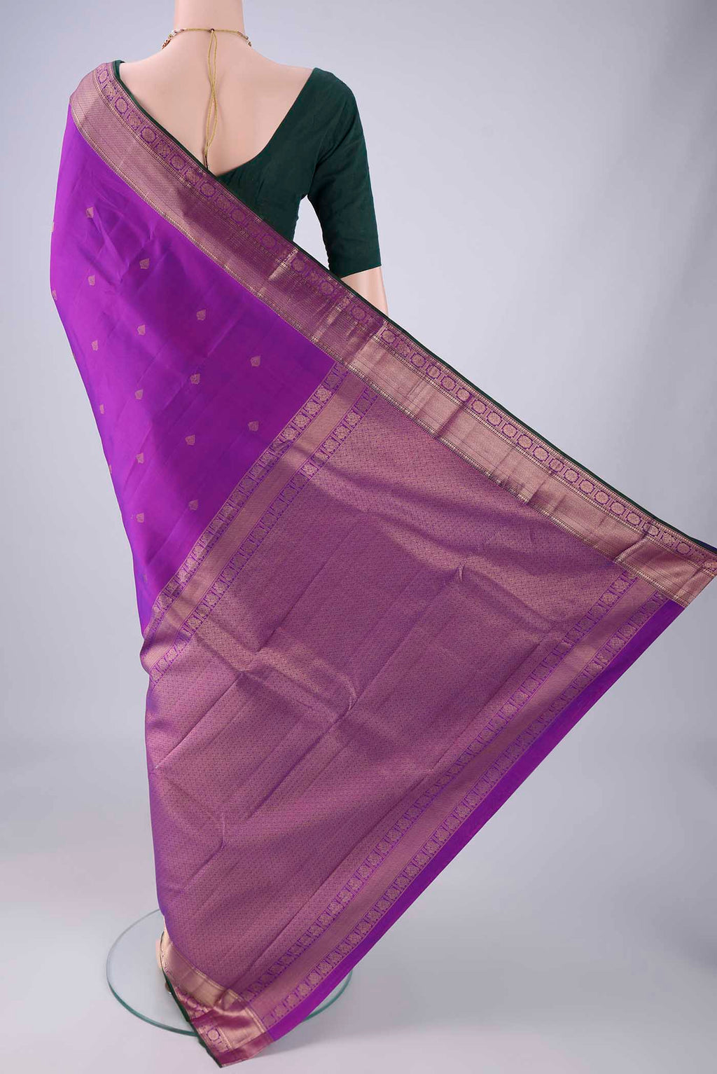 Flat view of Purple Kanchipuram Silk Saree with Zari Butta on the body and Zari Border. 