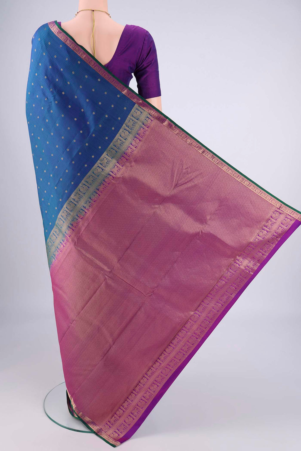Flat view of Peacock Blue Dual Tone Kanjivaram Silk Saree with Zari Butta on the body and Zari Border. 