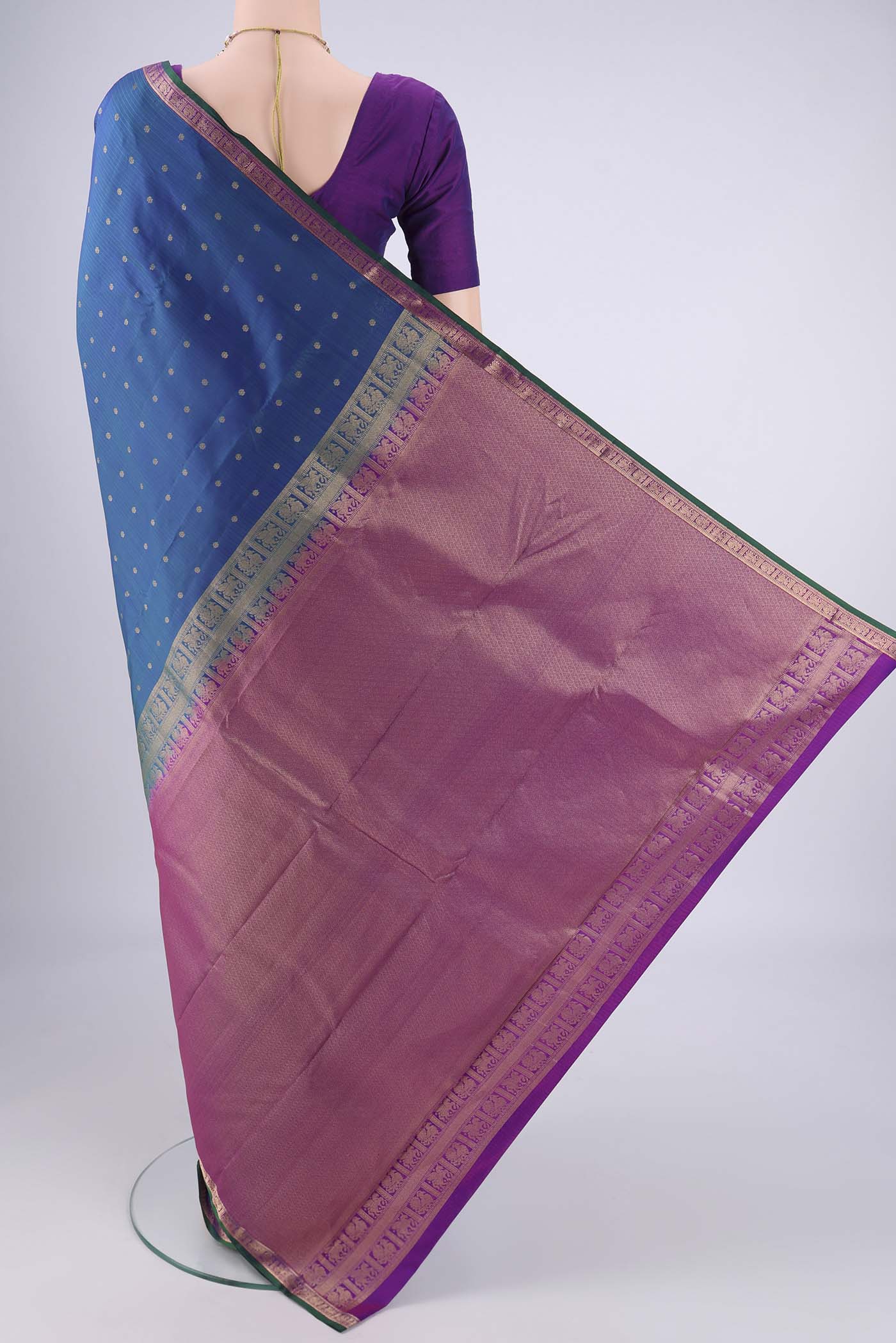 Flat view of Peacock Blue Dual Tone Kanjivaram Silk Saree with Zari Butta on the body and Zari Border. 