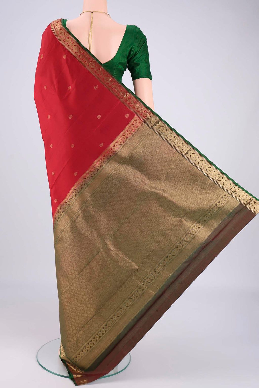 Flat view of Deep Red Kanchipuram Silk Saree with Zari Butta on the body and Zari Border. 