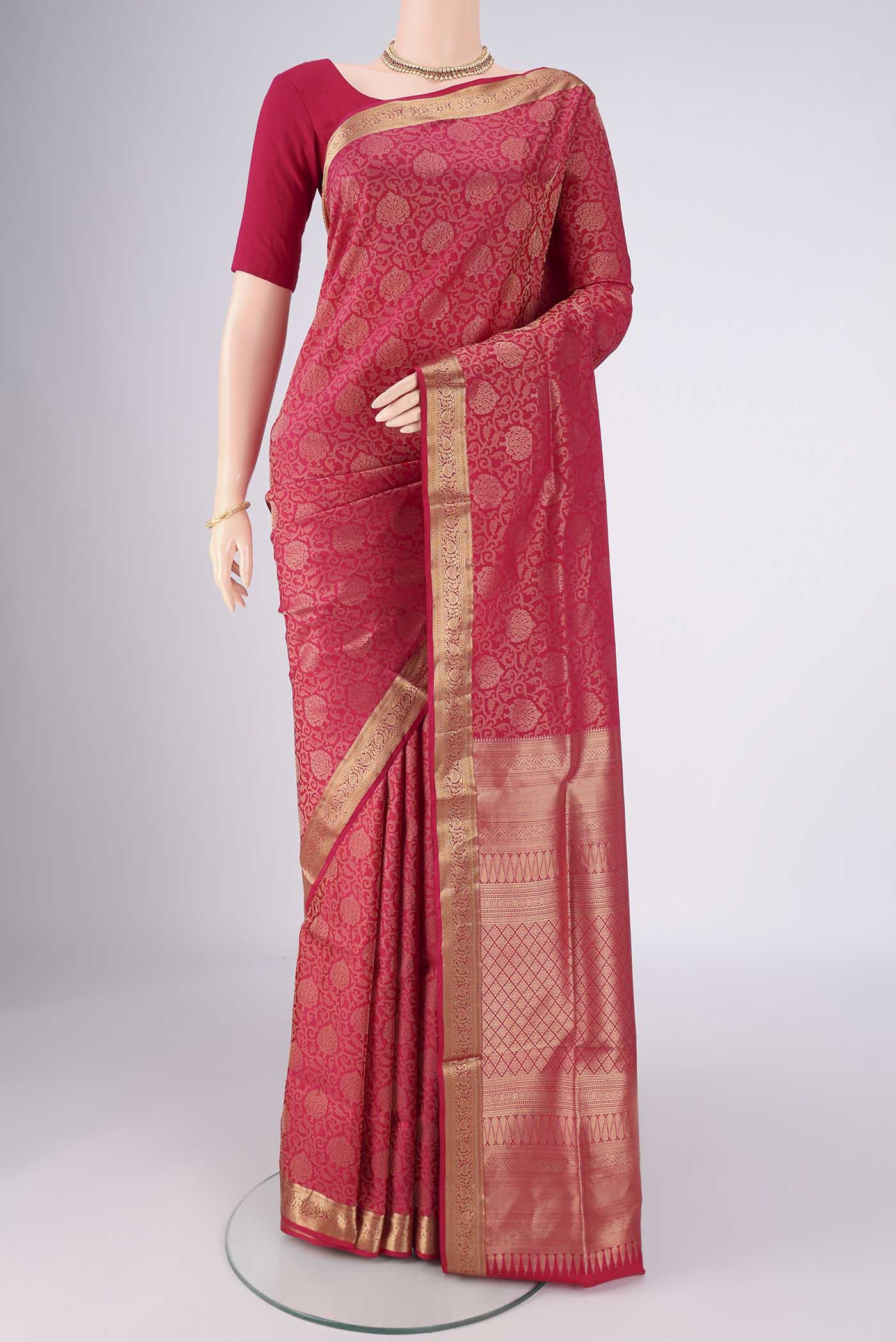 Dark Pink Soft Silk Saree with Zari Brocade on the body and Zari Border.  displayed on a mannequin
