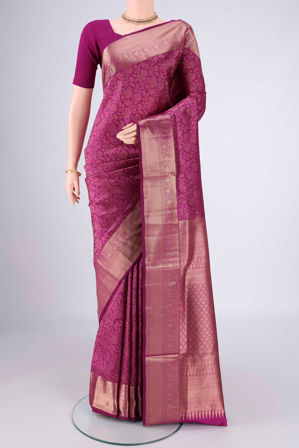 Magenta Soft Silk Saree with Zari Brocade on the body and Zari Border.  displayed on a mannequin