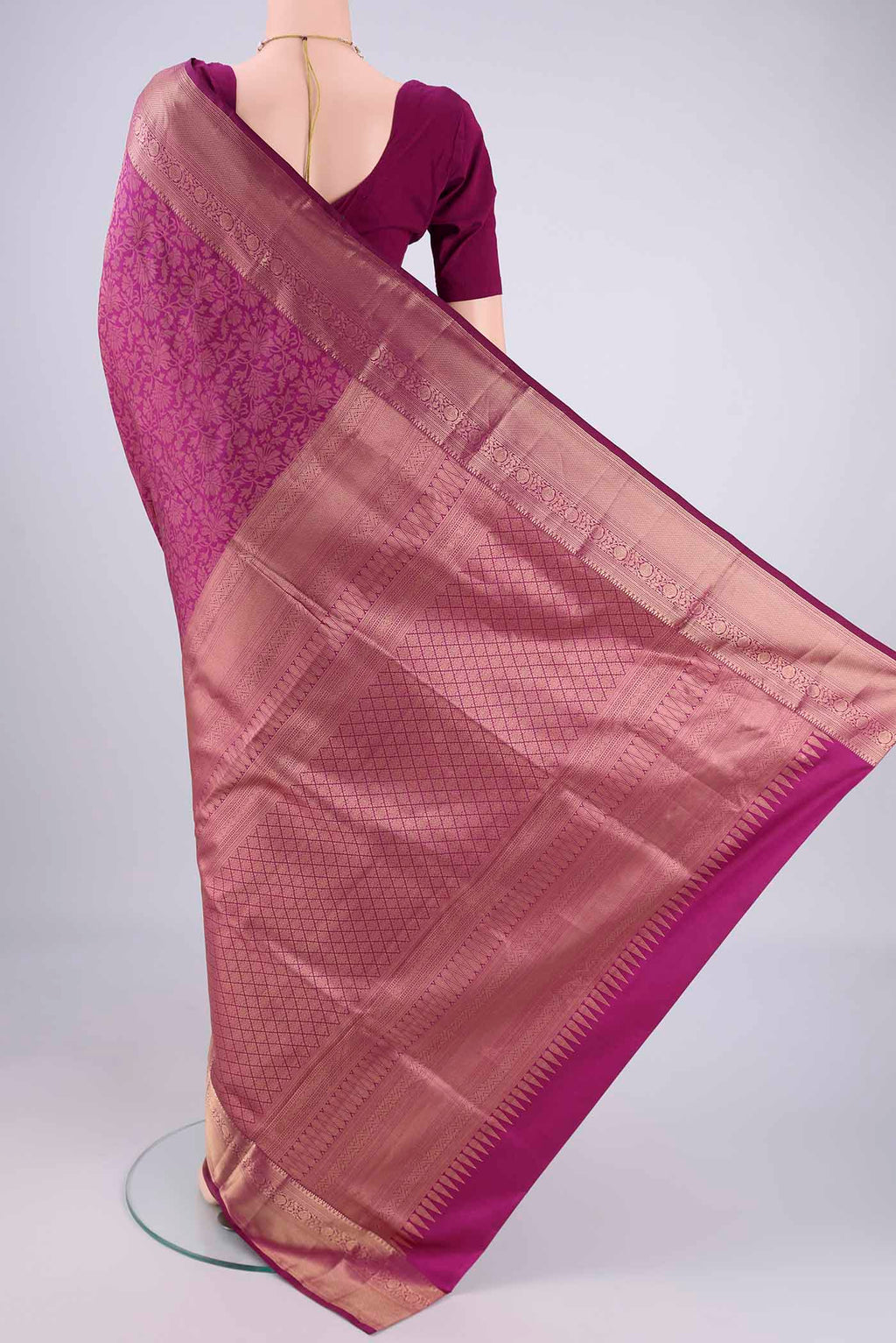 Flat view of Magenta Soft Silk Saree with Zari Brocade on the body and Zari Border. 