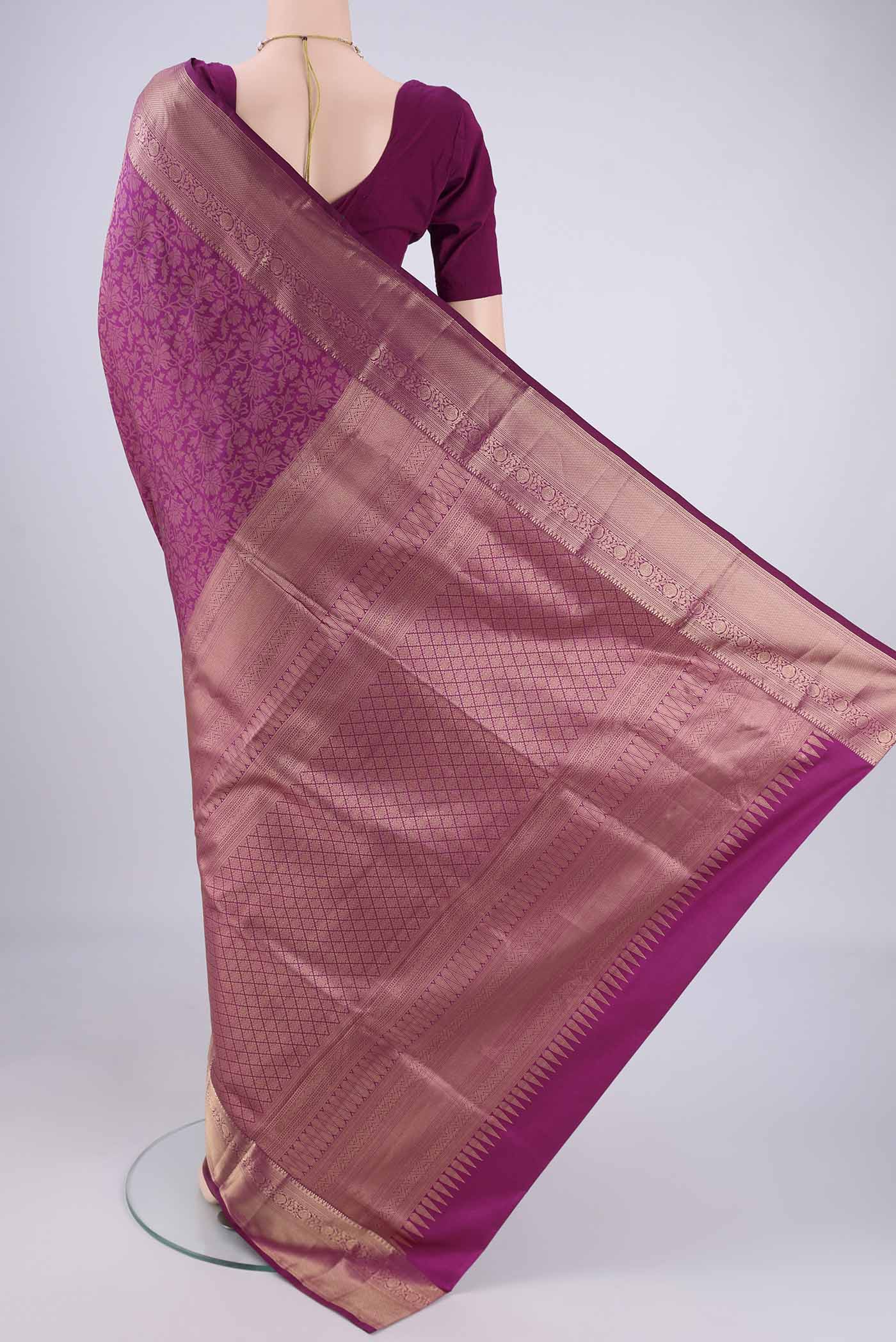 Flat view of Magenta Soft Silk Saree with Zari Brocade on the body and Zari Border. 