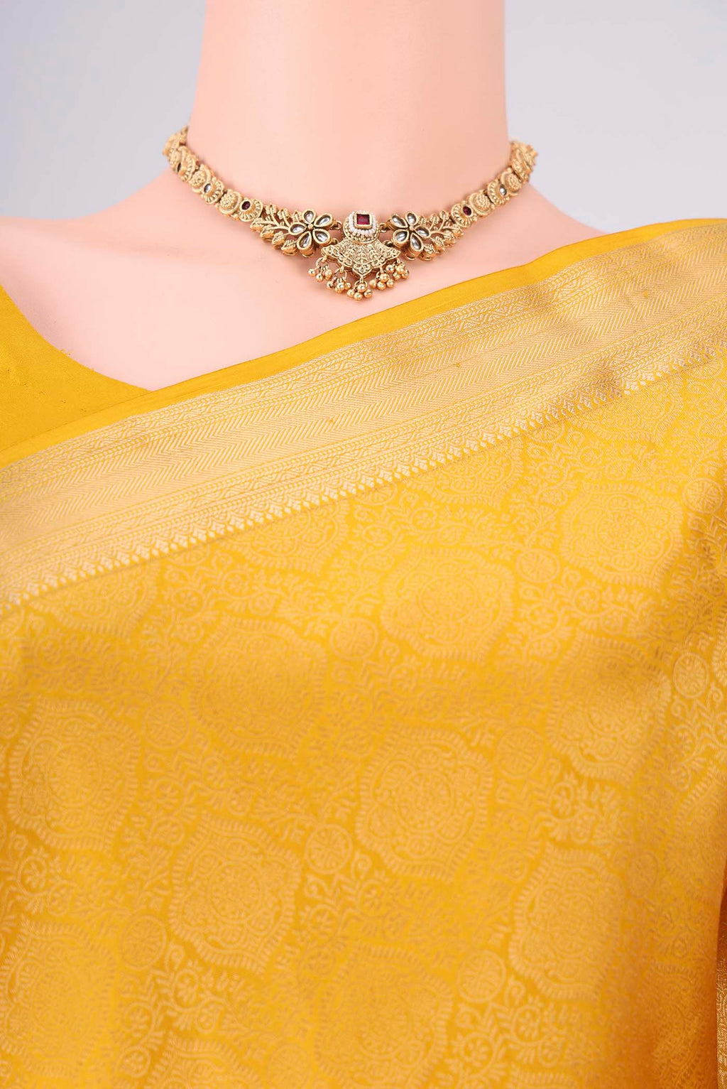Border image of Yellow Soft Silk Saree with Zari Brocade on the body and Zari Border. 