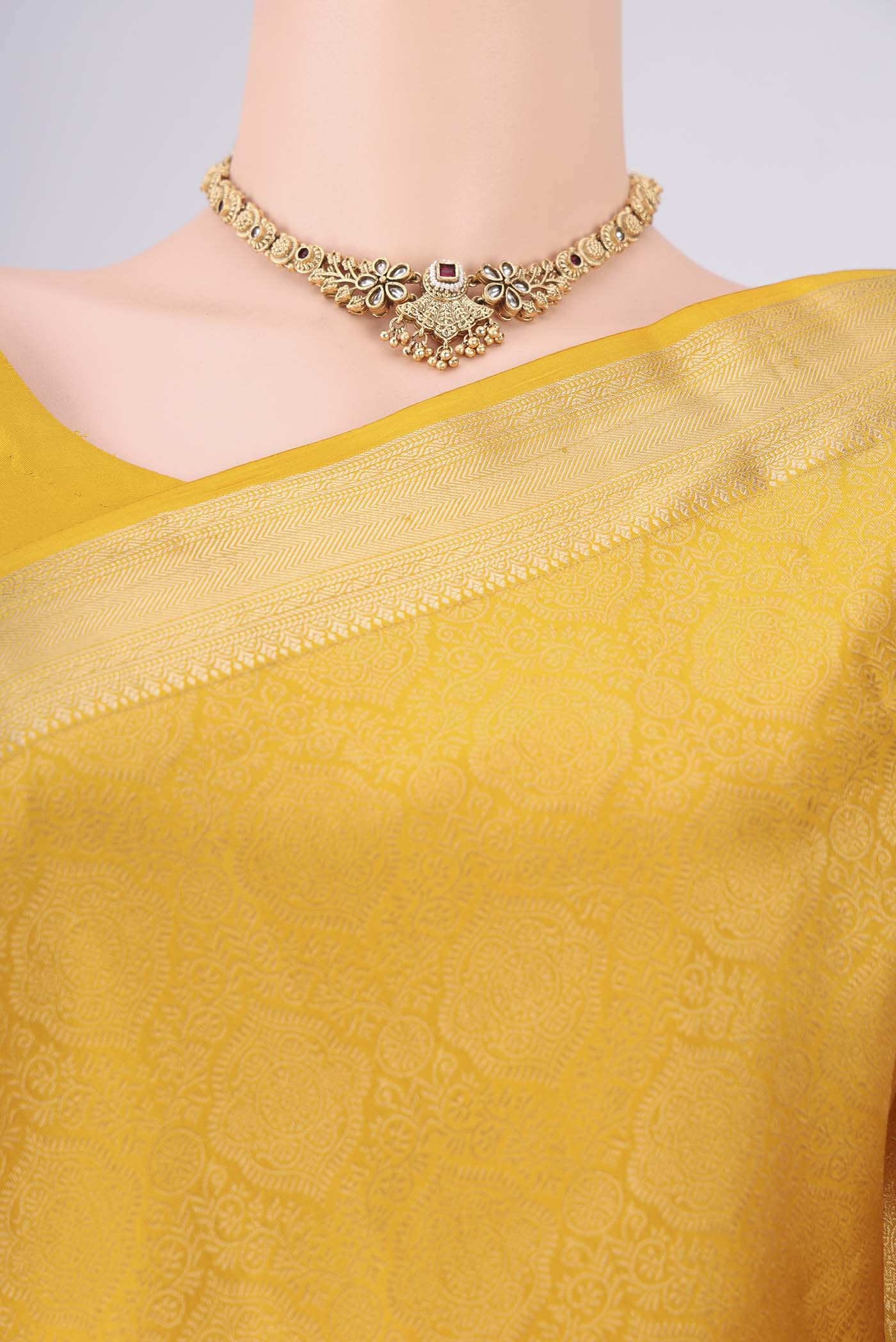 Border image of Yellow Soft Silk Saree with Zari Brocade on the body and Zari Border. 