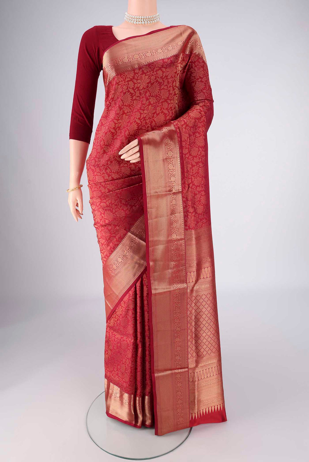 Maroon Soft Silk Saree with Zari Brocade on the body and Zari Border.  displayed on a mannequin