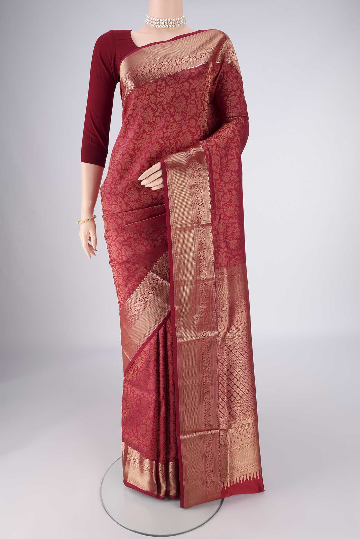 Maroon Soft Silk Saree with Zari Brocade on the body and Zari Border.  displayed on a mannequin