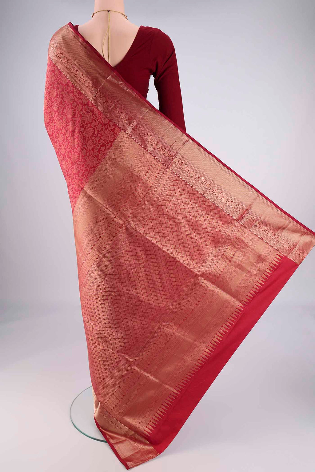 Flat view of Maroon Soft Silk Saree with Zari Brocade on the body and Zari Border. 