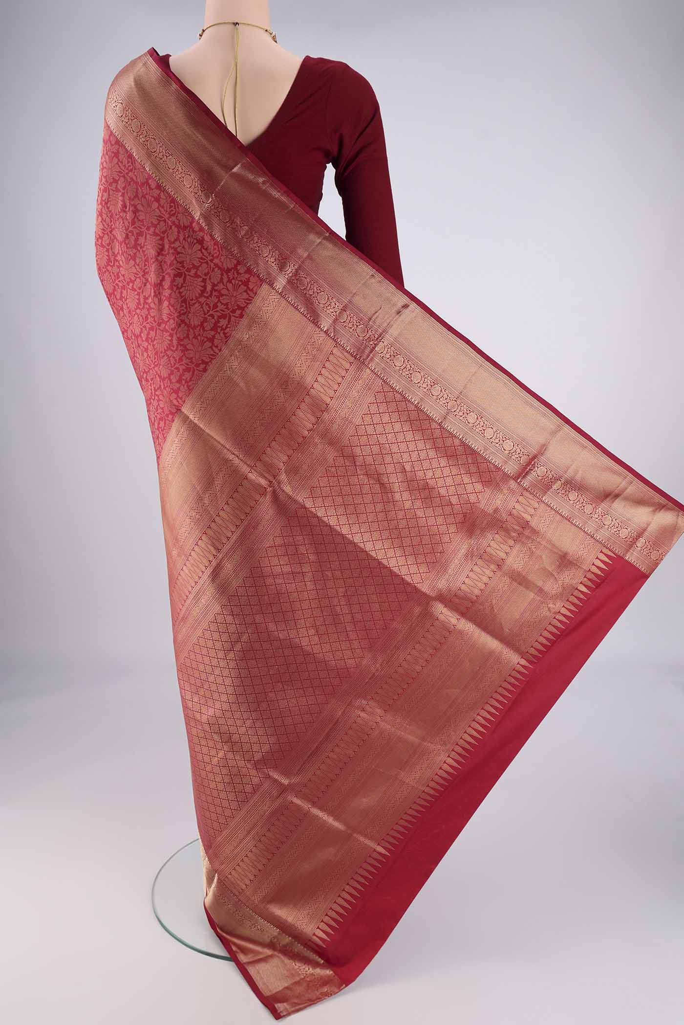 Flat view of Maroon Soft Silk Saree with Zari Brocade on the body and Zari Border. 