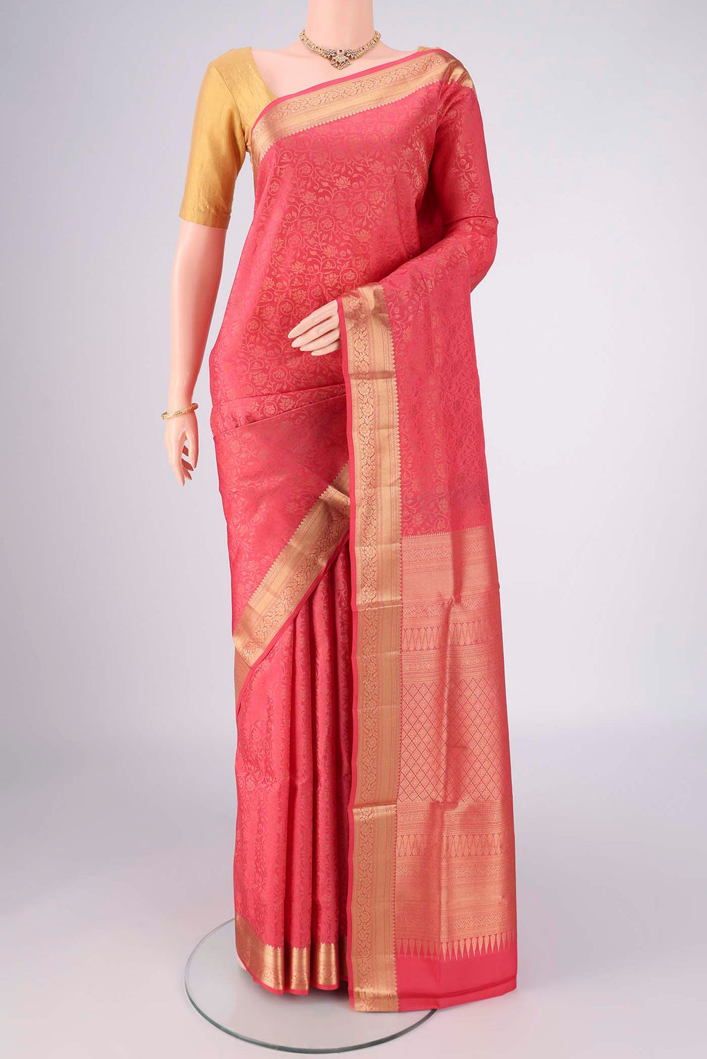 Coral Dual Tone Soft Silk Saree with Zari Brocade on the body and Zari Border.  displayed on a mannequin