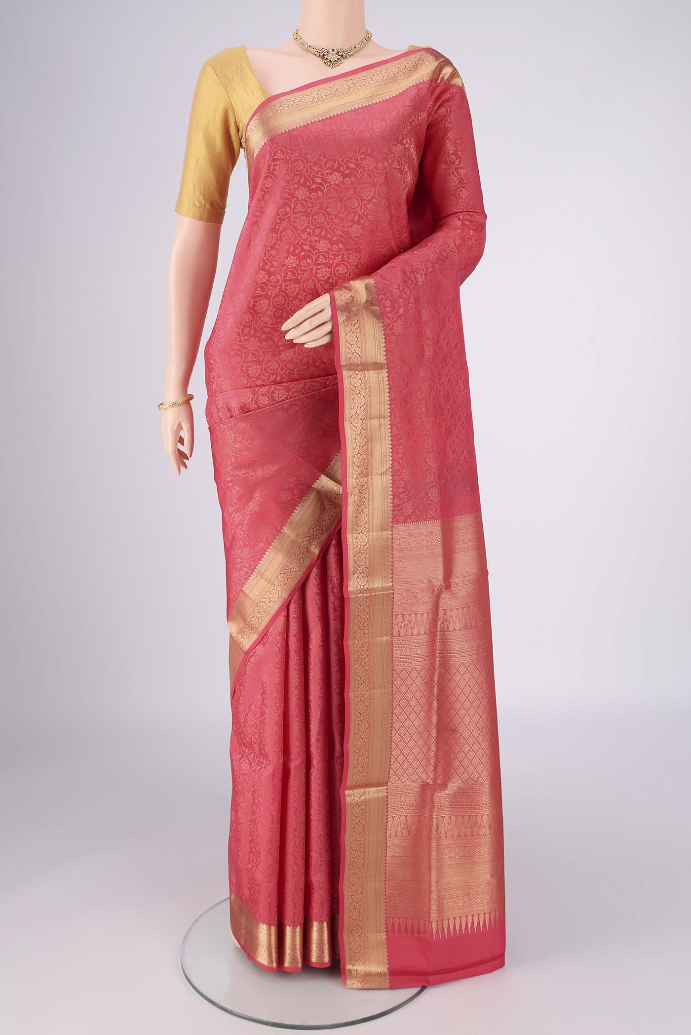 Coral Dual Tone Soft Silk Saree with Zari Brocade on the body and Zari Border.  displayed on a mannequin