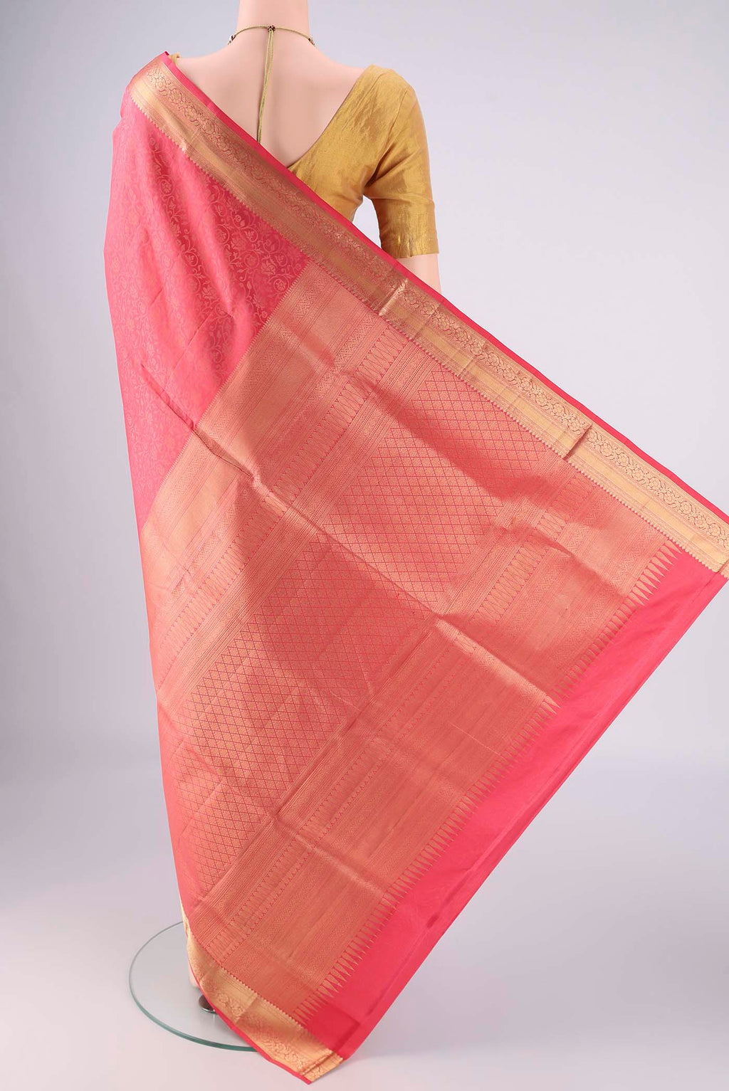 Flat view of Coral Dual Tone Soft Silk Saree with Zari Brocade on the body and Zari Border. 