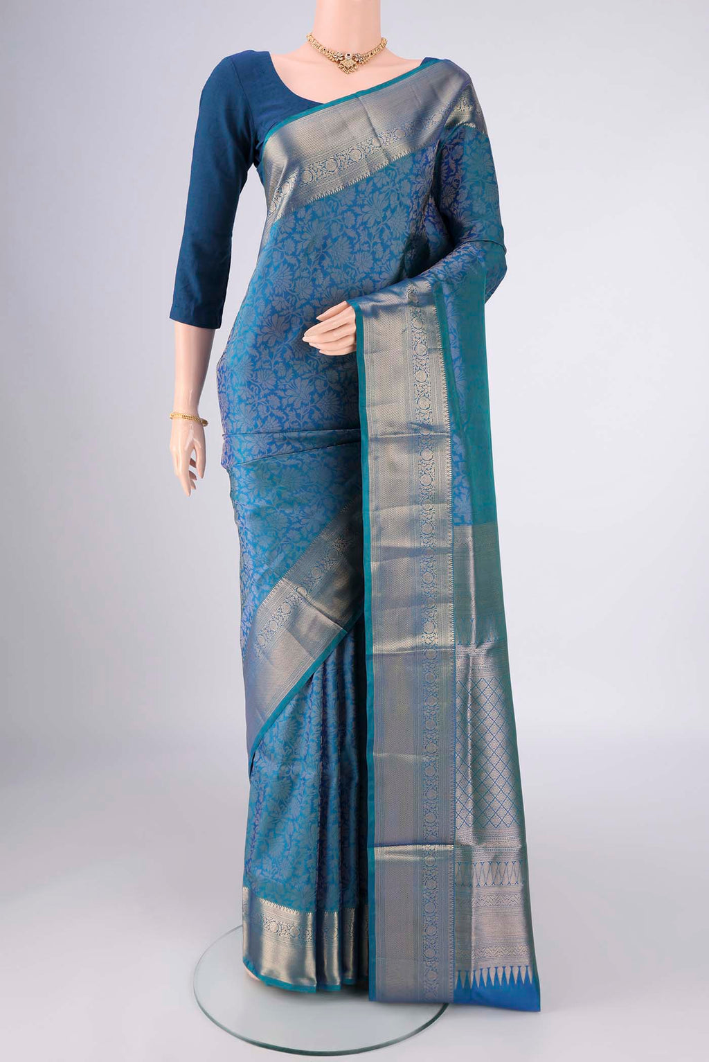 Blue Soft Silk Saree with Zari Brocade on the body and Zari Border.  displayed on a mannequin