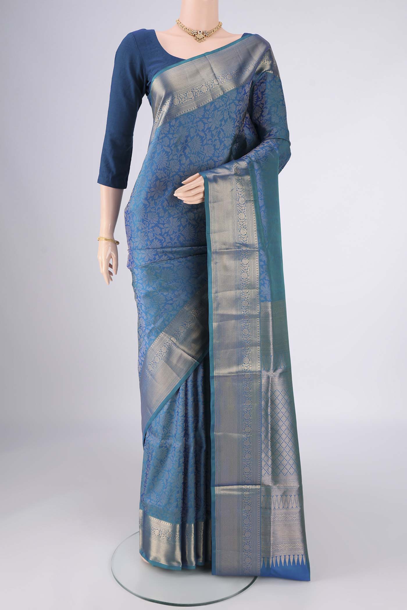 Blue Soft Silk Saree with Zari Brocade on the body and Zari Border.  displayed on a mannequin