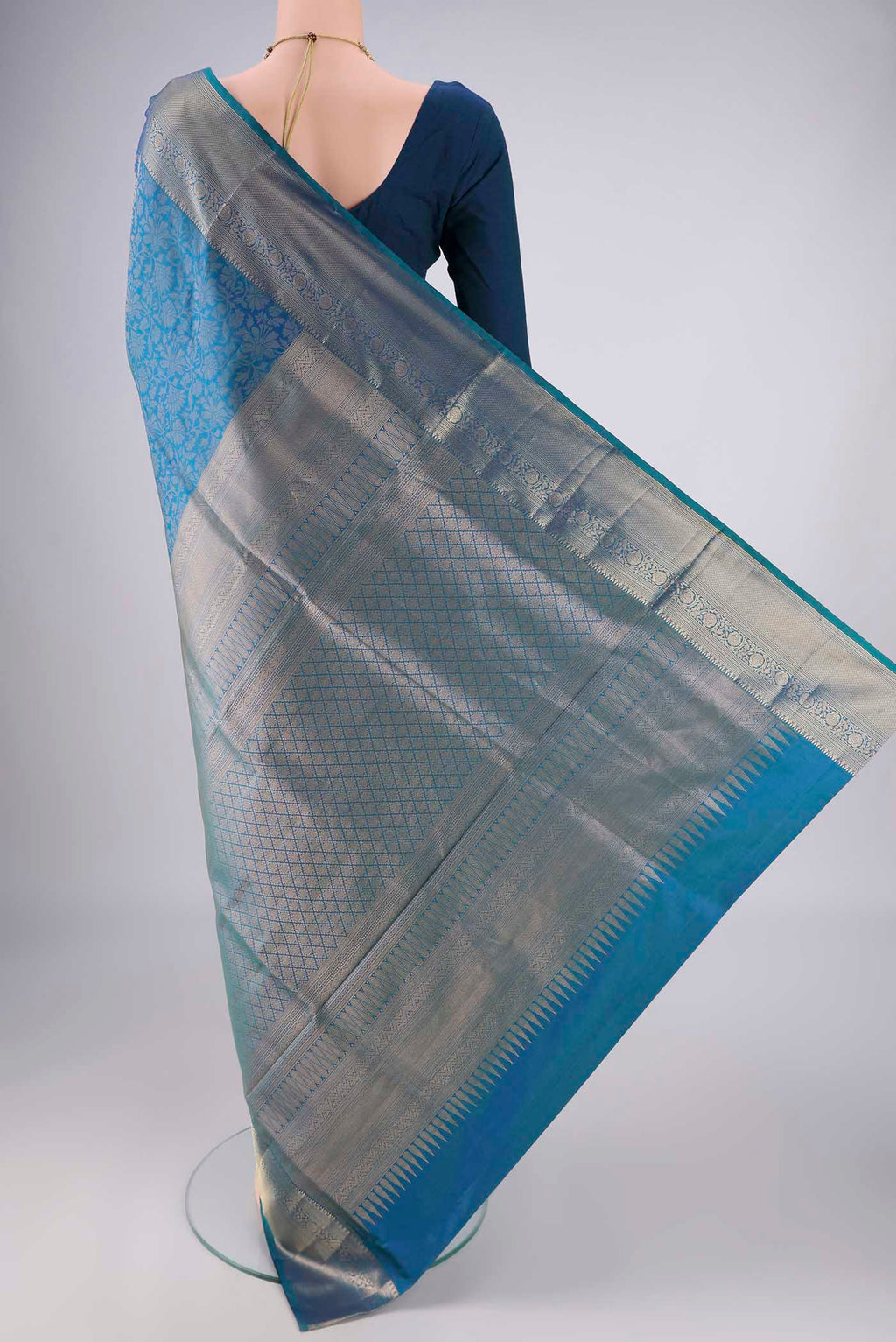Flat view of Blue Soft Silk Saree with Zari Brocade on the body and Zari Border. 