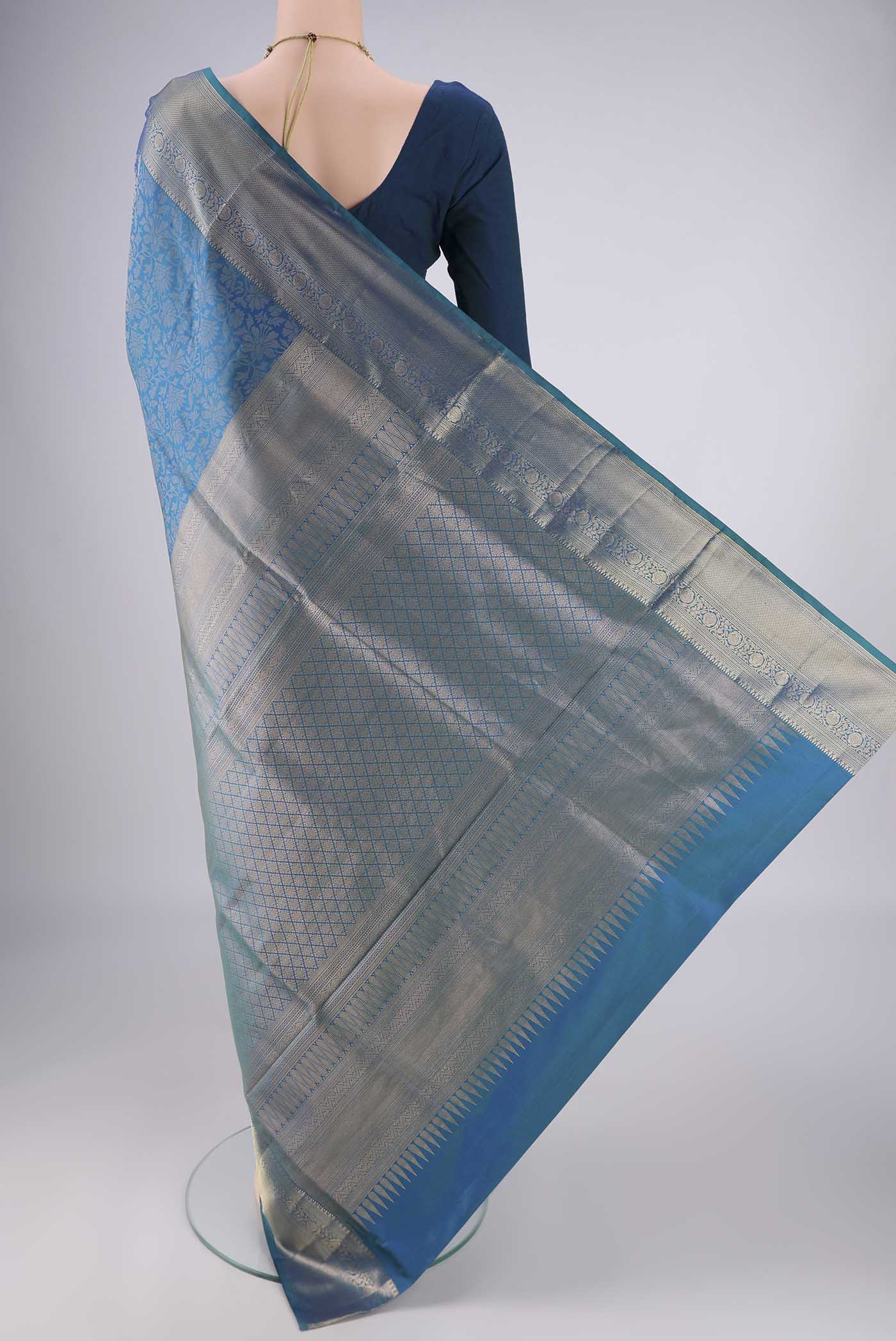 Flat view of Blue Soft Silk Saree with Zari Brocade on the body and Zari Border. 