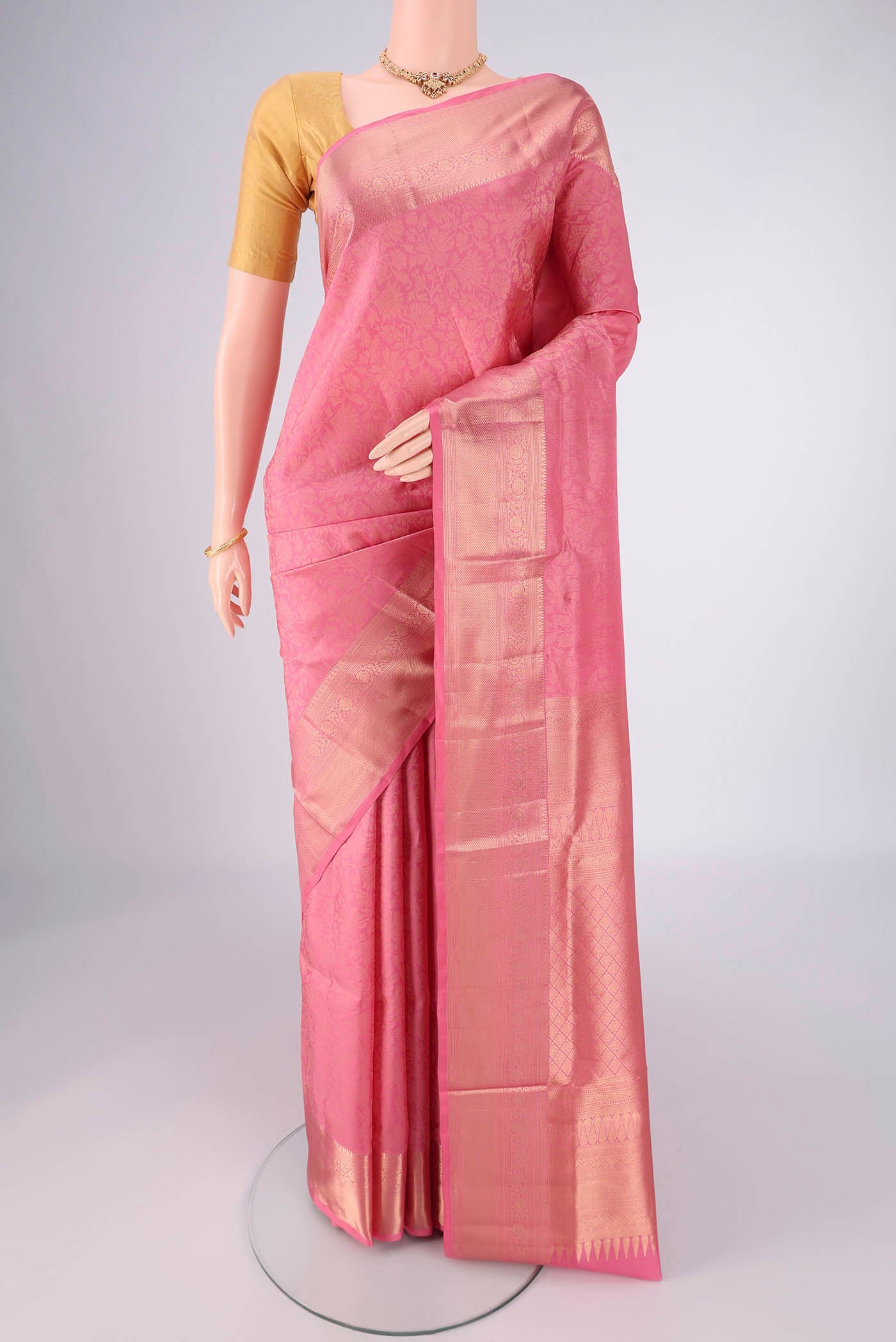 Rose pink Soft Silk Saree with Zari Brocade on the body and Zari Border.  displayed on a mannequin