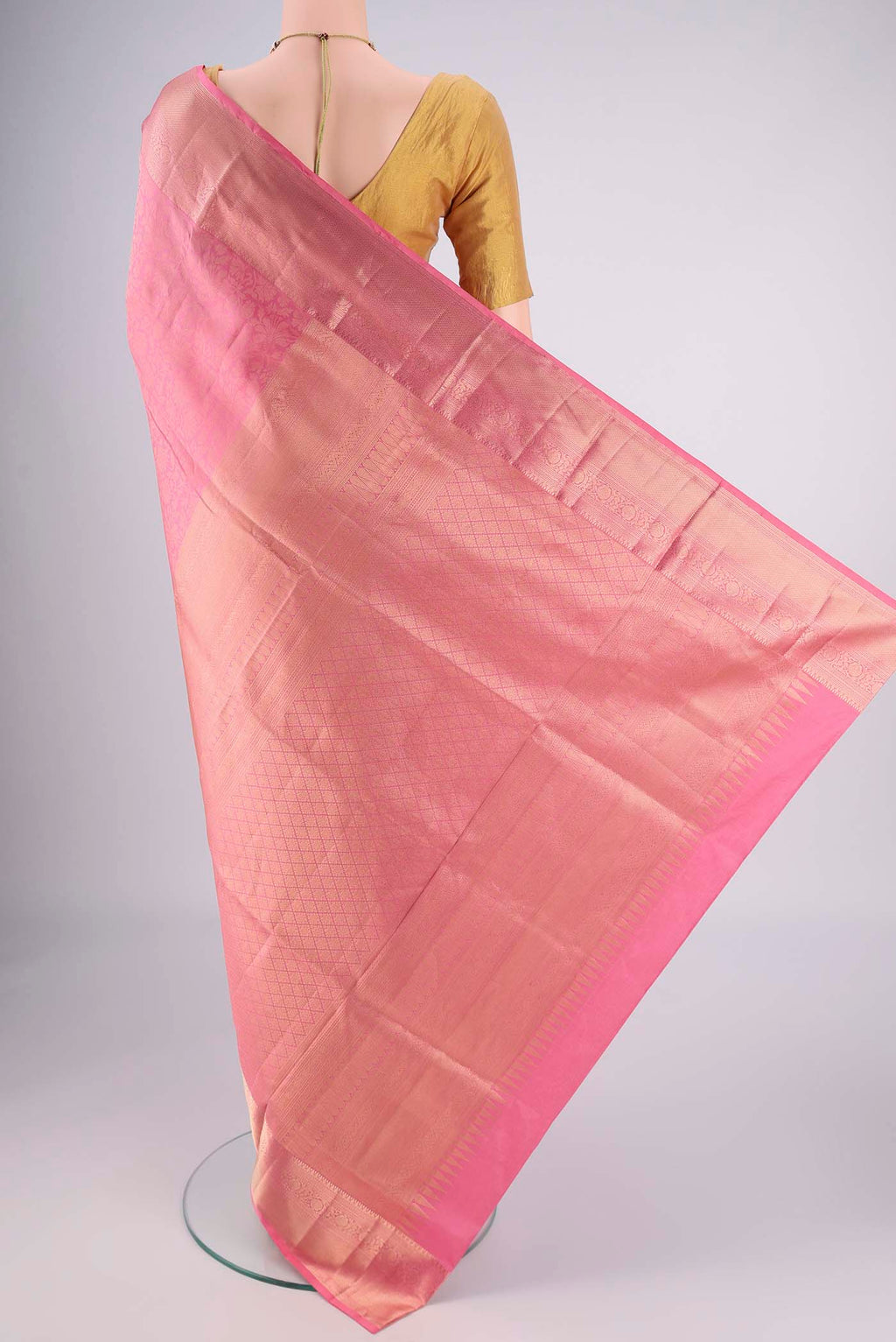 Flat view of Rose pink Soft Silk Saree with Zari Brocade on the body and Zari Border. 