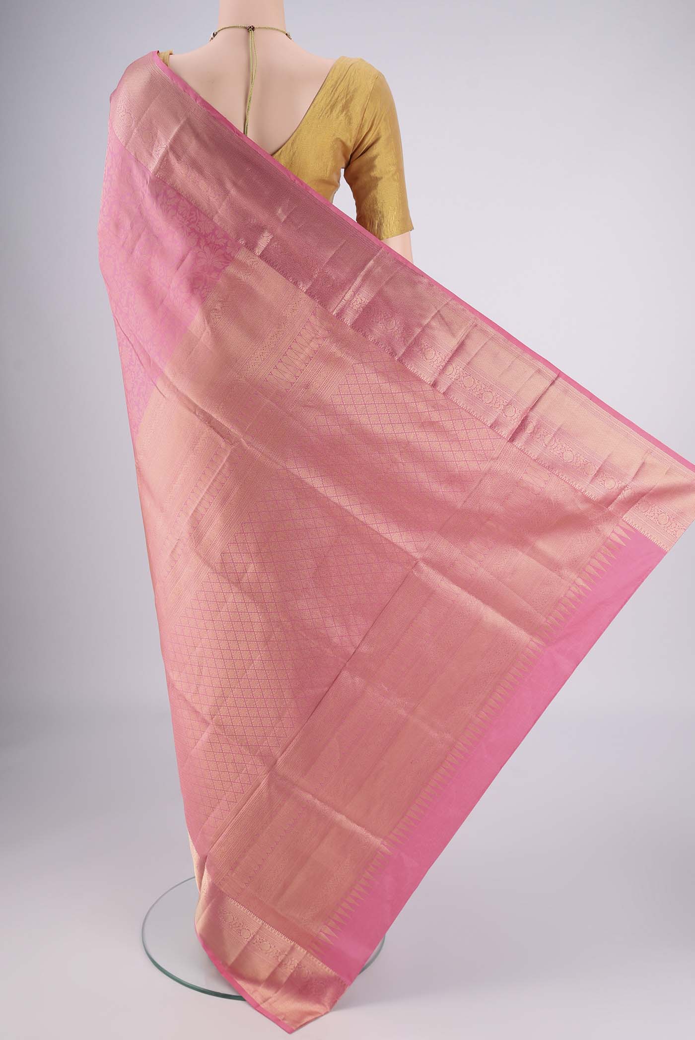 Flat view of Rose pink Soft Silk Saree with Zari Brocade on the body and Zari Border. 