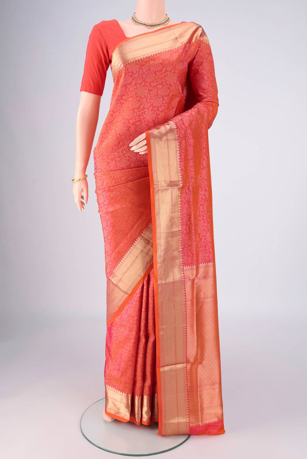 Brick Orange Dual Tone Soft Silk Saree with Zari Brocade on the body and Zari Border.  displayed on a mannequin