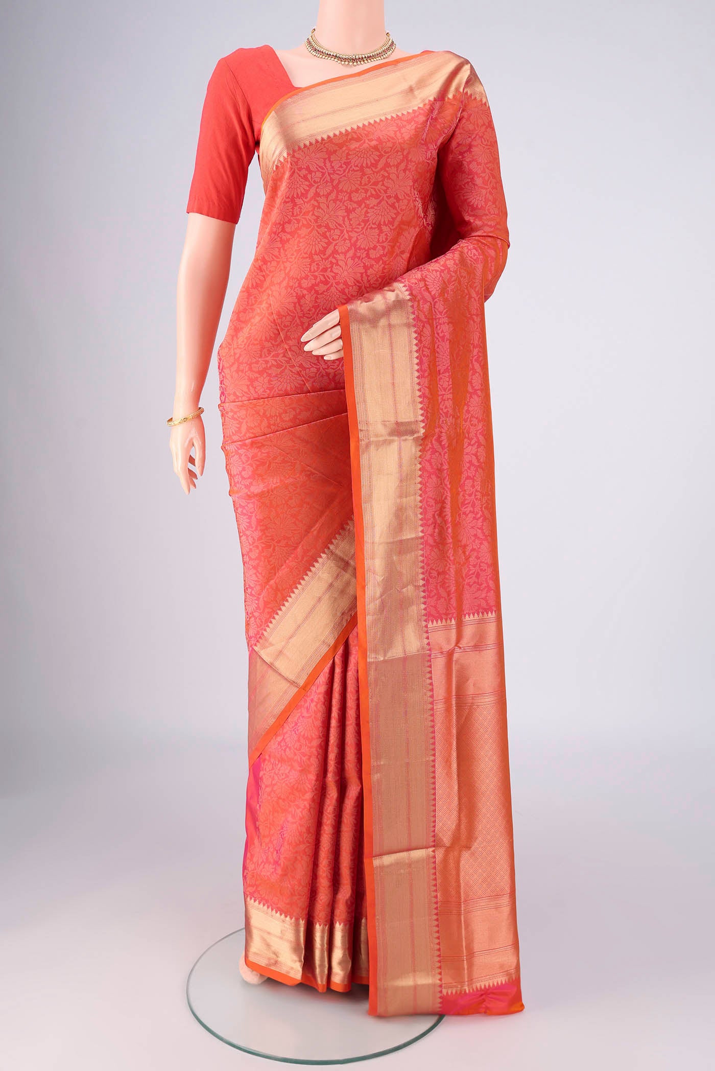Brick Orange Dual Tone Soft Silk Saree with Zari Brocade on the body and Zari Border.  displayed on a mannequin