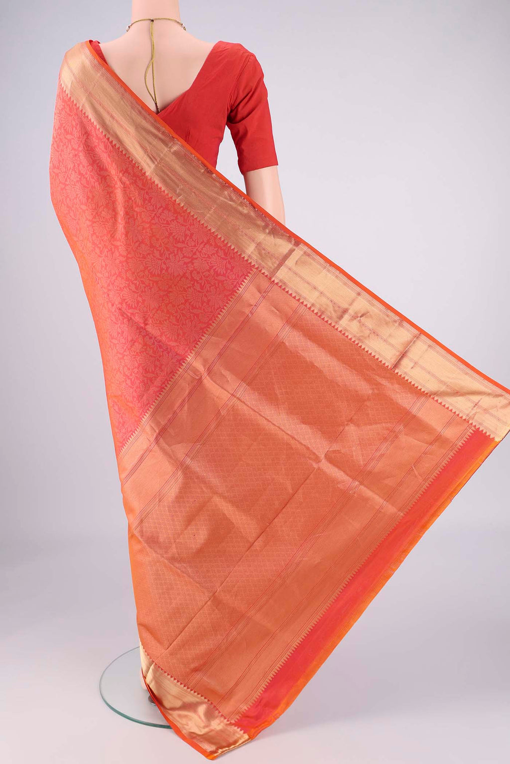 Flat view of Brick Orange Dual Tone Soft Silk Saree with Zari Brocade on the body and Zari Border. 