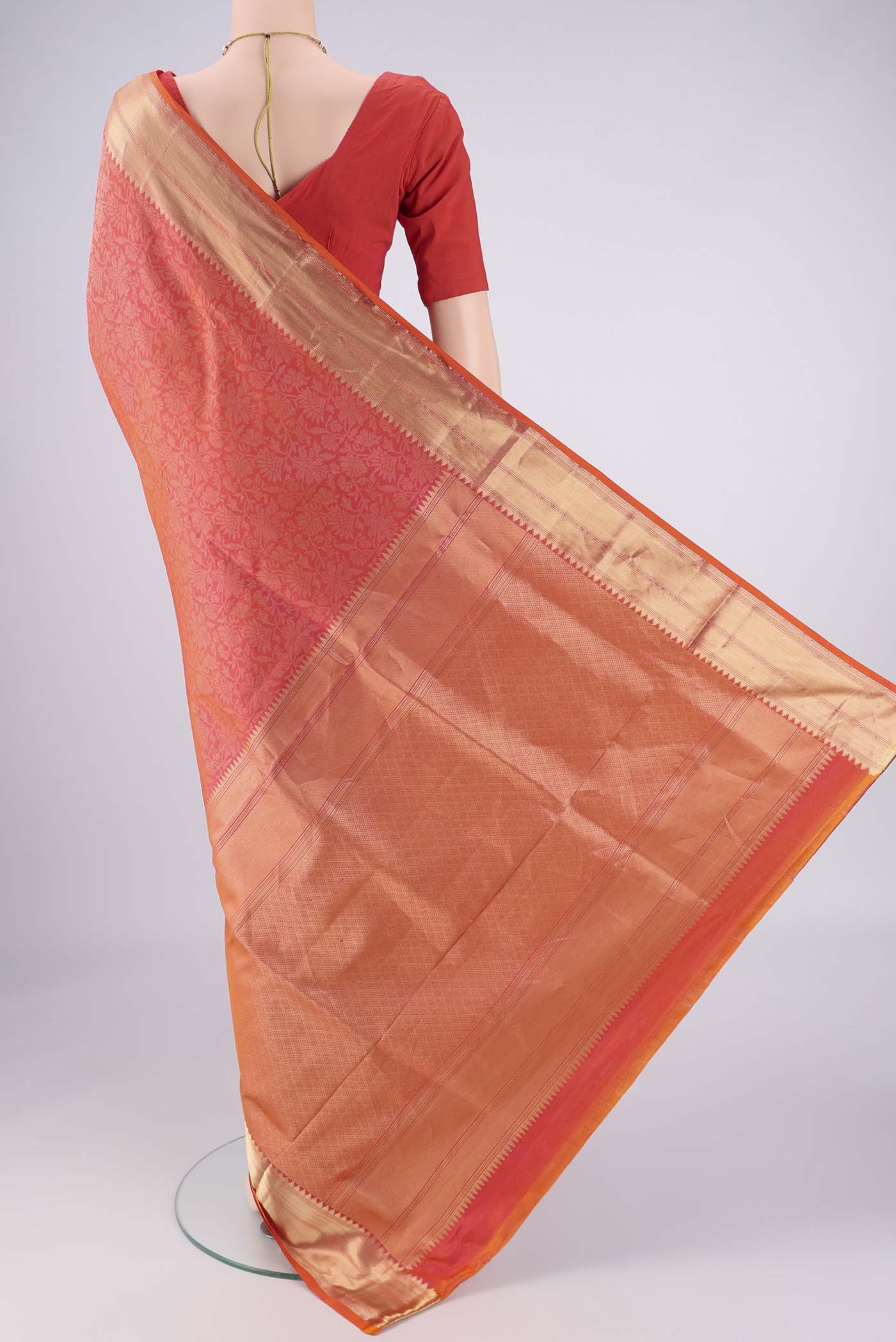 Flat view of Brick Orange Dual Tone Soft Silk Saree with Zari Brocade on the body and Zari Border. 