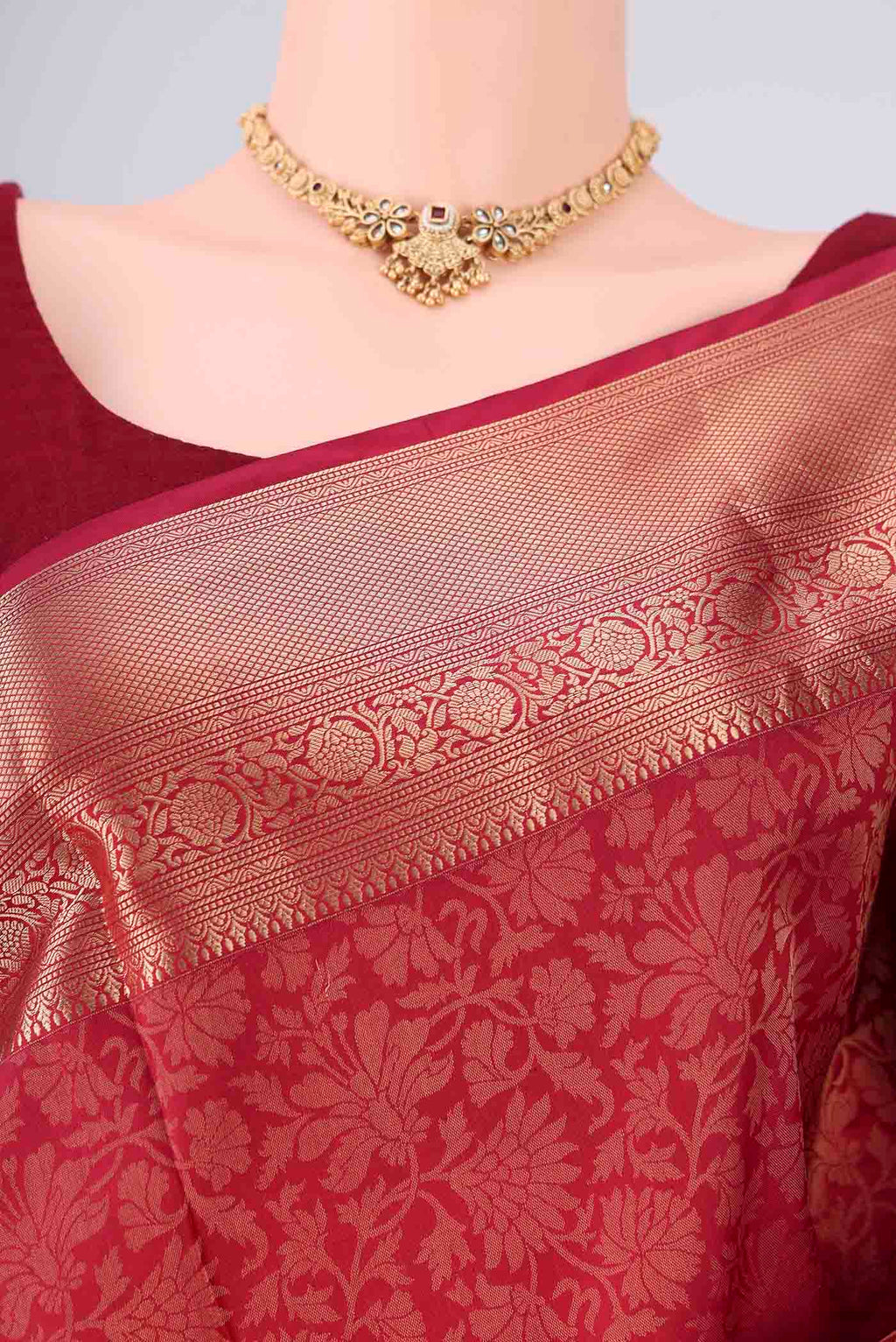 Border image of Maroon Soft Silk Saree with Zari Brocade on the body and Zari Border. 