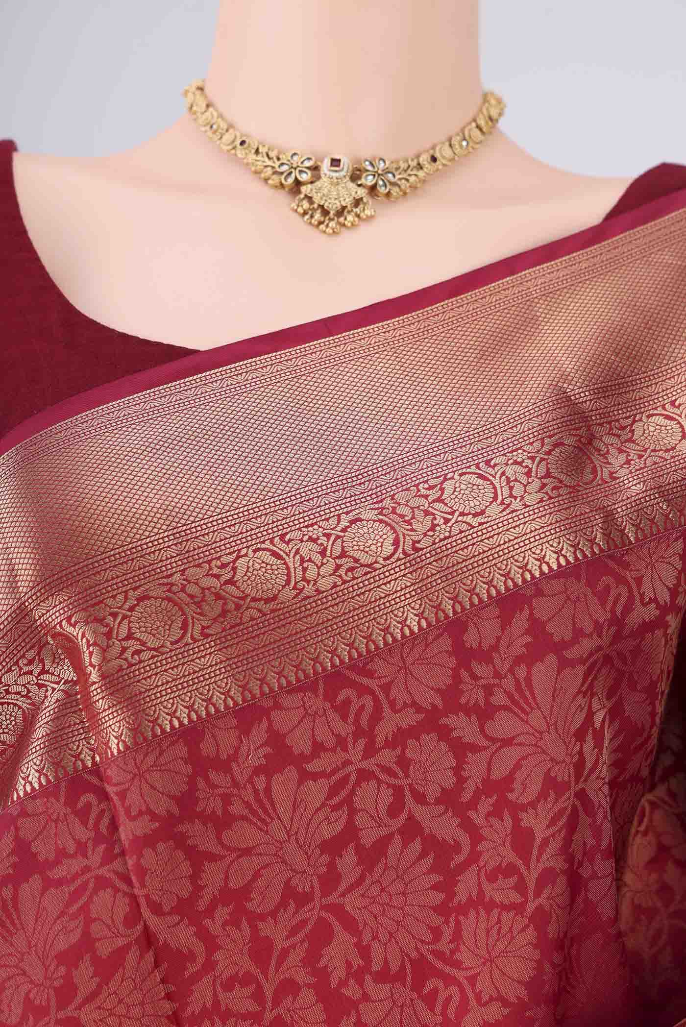 Border image of Maroon Soft Silk Saree with Zari Brocade on the body and Zari Border. 