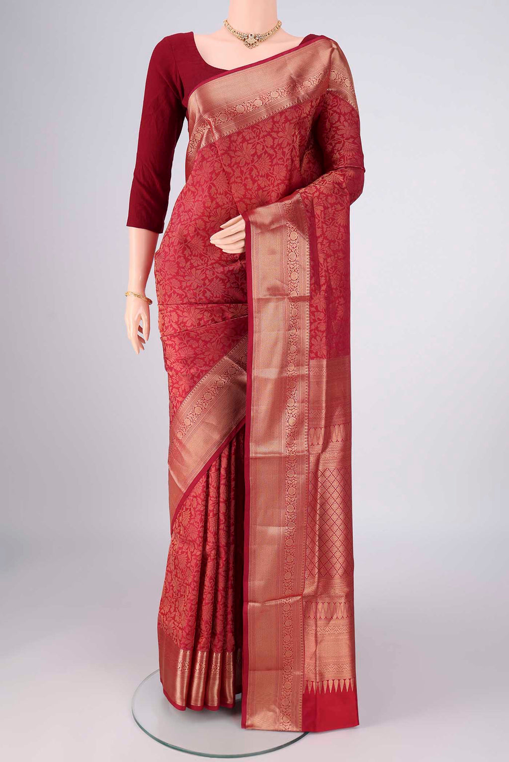 Maroon Soft Silk Saree with Zari Brocade on the body and Zari Border.  displayed on a mannequin