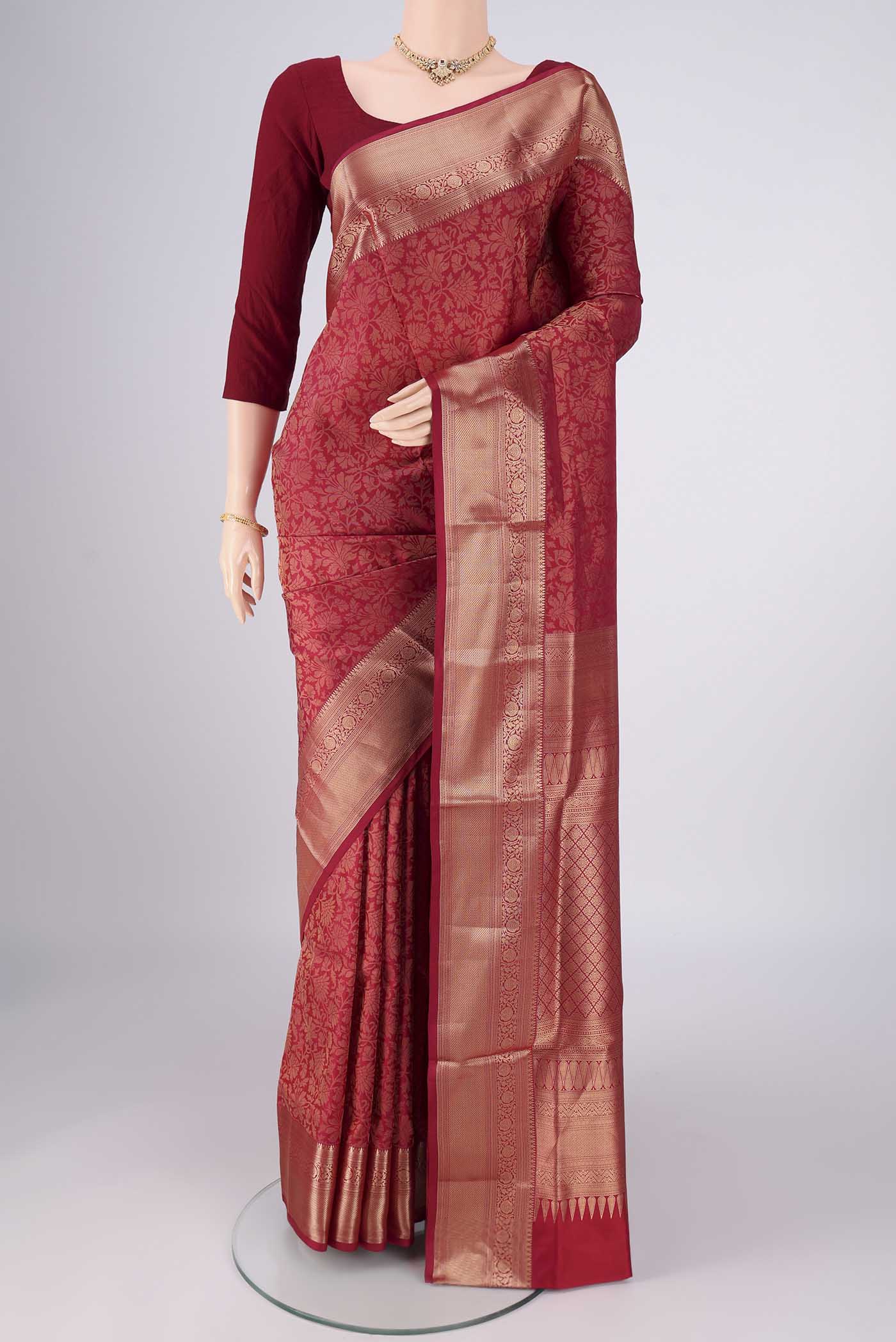 Maroon Soft Silk Saree with Zari Brocade on the body and Zari Border.  displayed on a mannequin