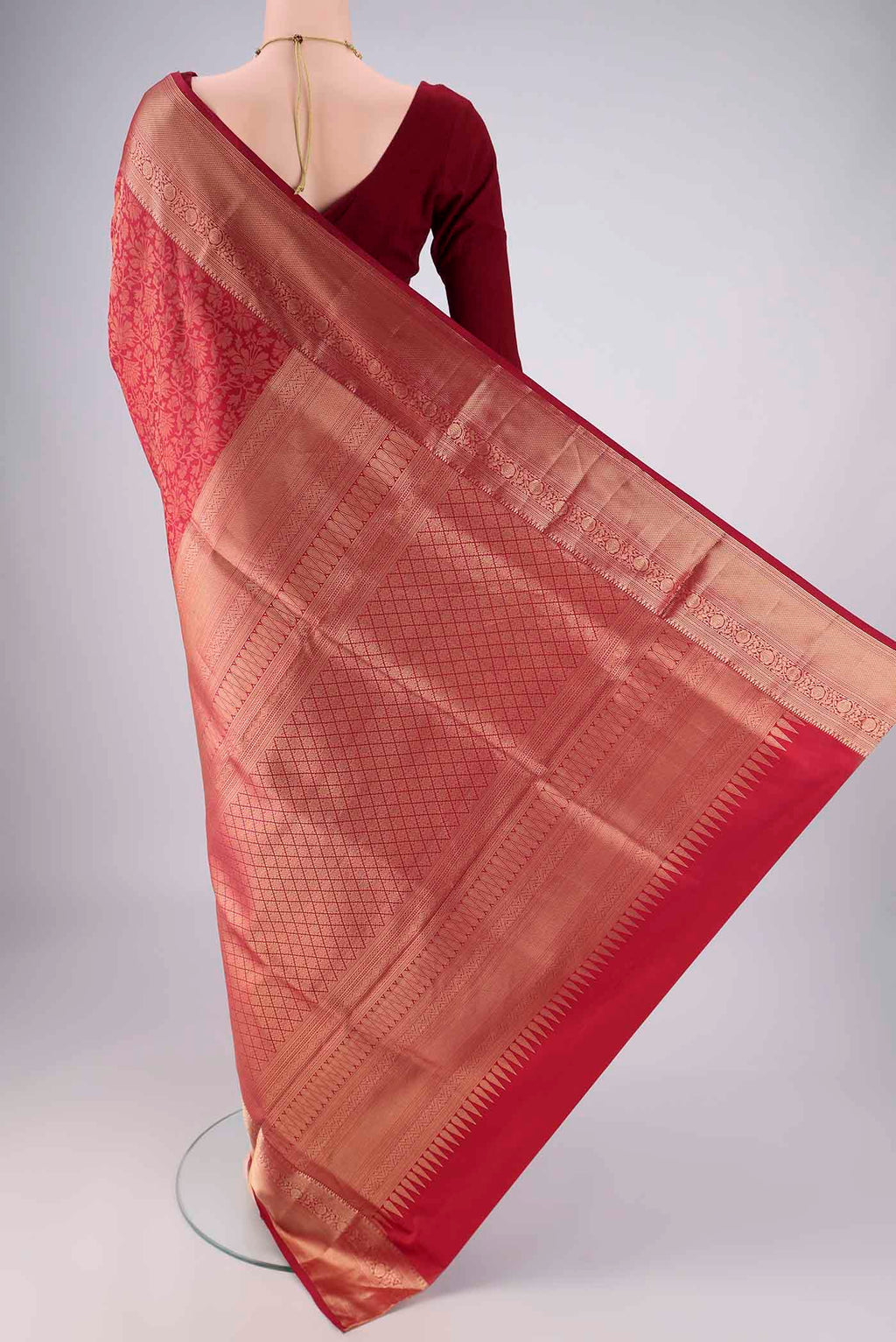 Flat view of Maroon Soft Silk Saree with Zari Brocade on the body and Zari Border. 