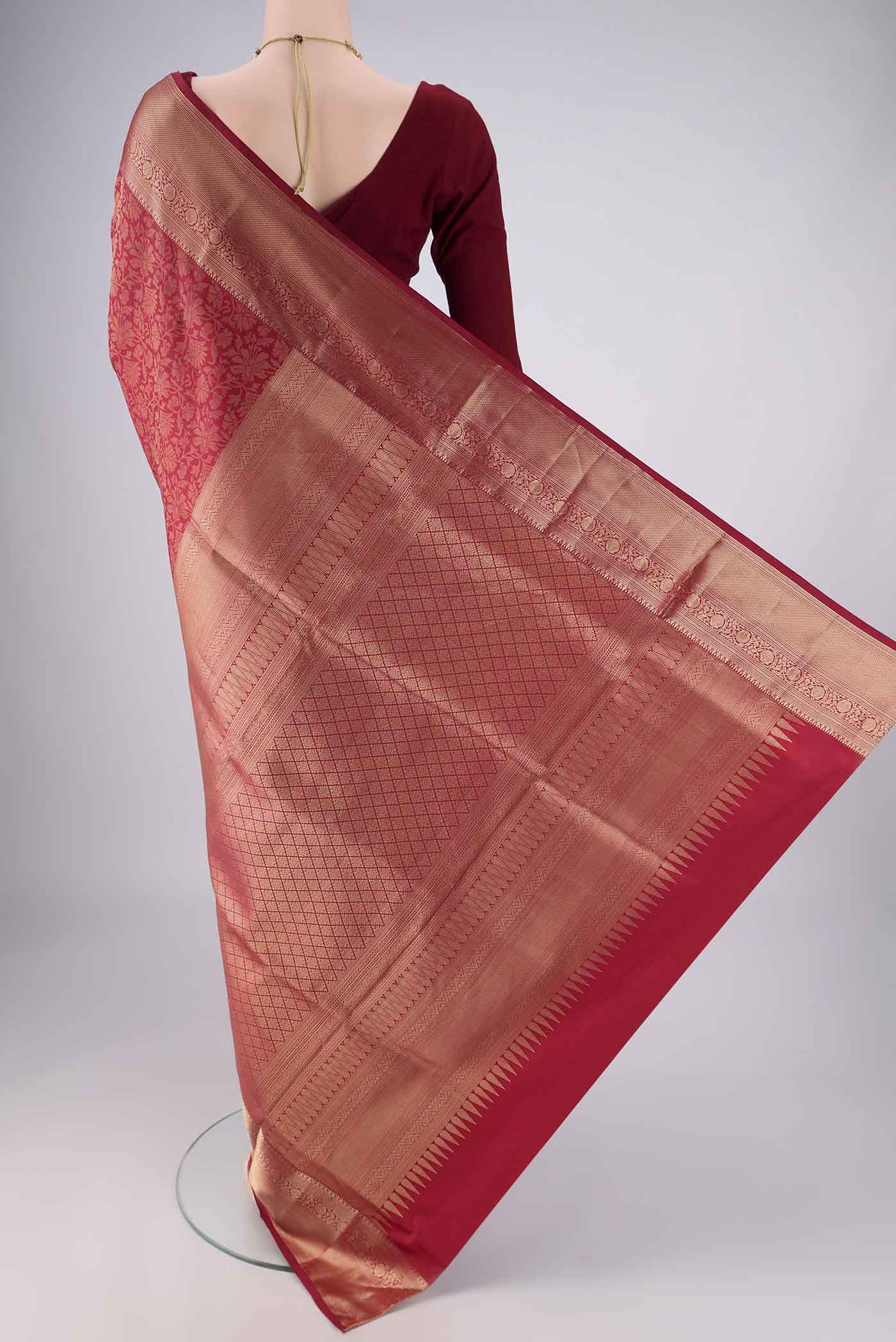 Flat view of Maroon Soft Silk Saree with Zari Brocade on the body and Zari Border. 