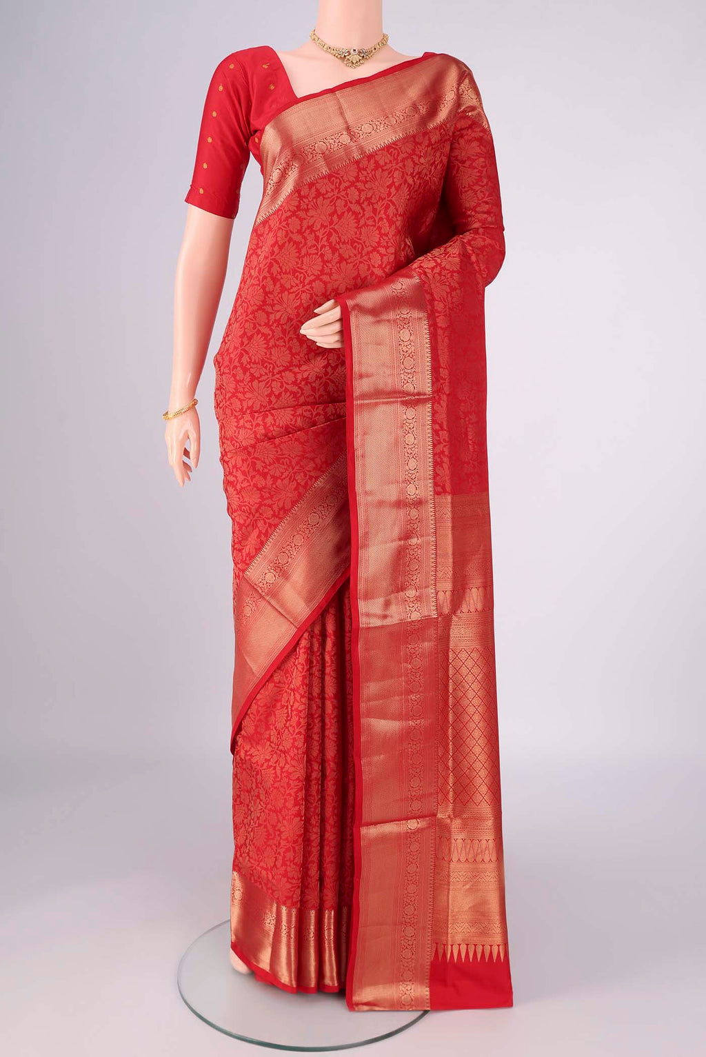Red Soft Silk Saree with Zari Brocade on the body and Zari Border.  displayed on a mannequin
