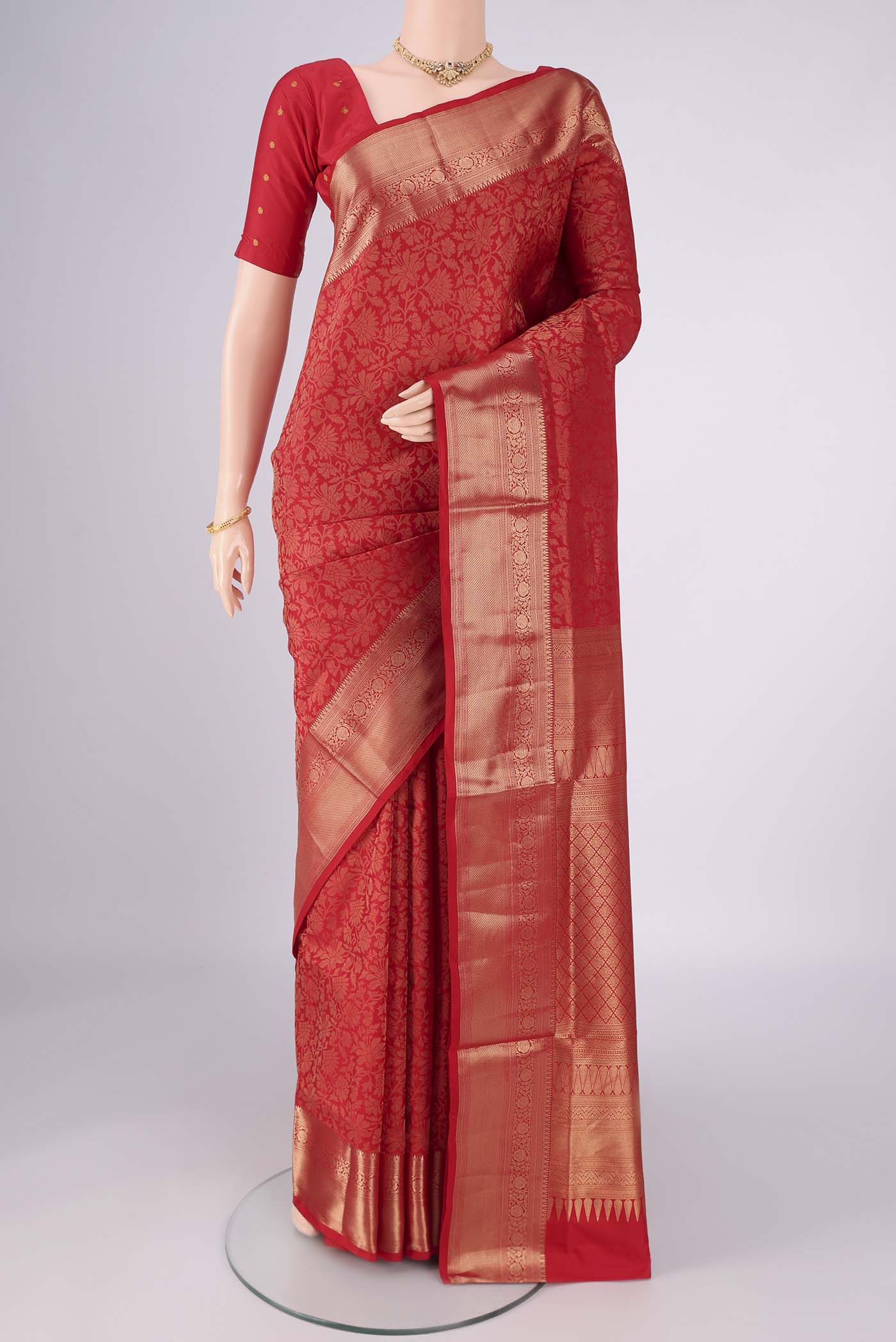 Red Soft Silk Saree with Zari Brocade on the body and Zari Border.  displayed on a mannequin