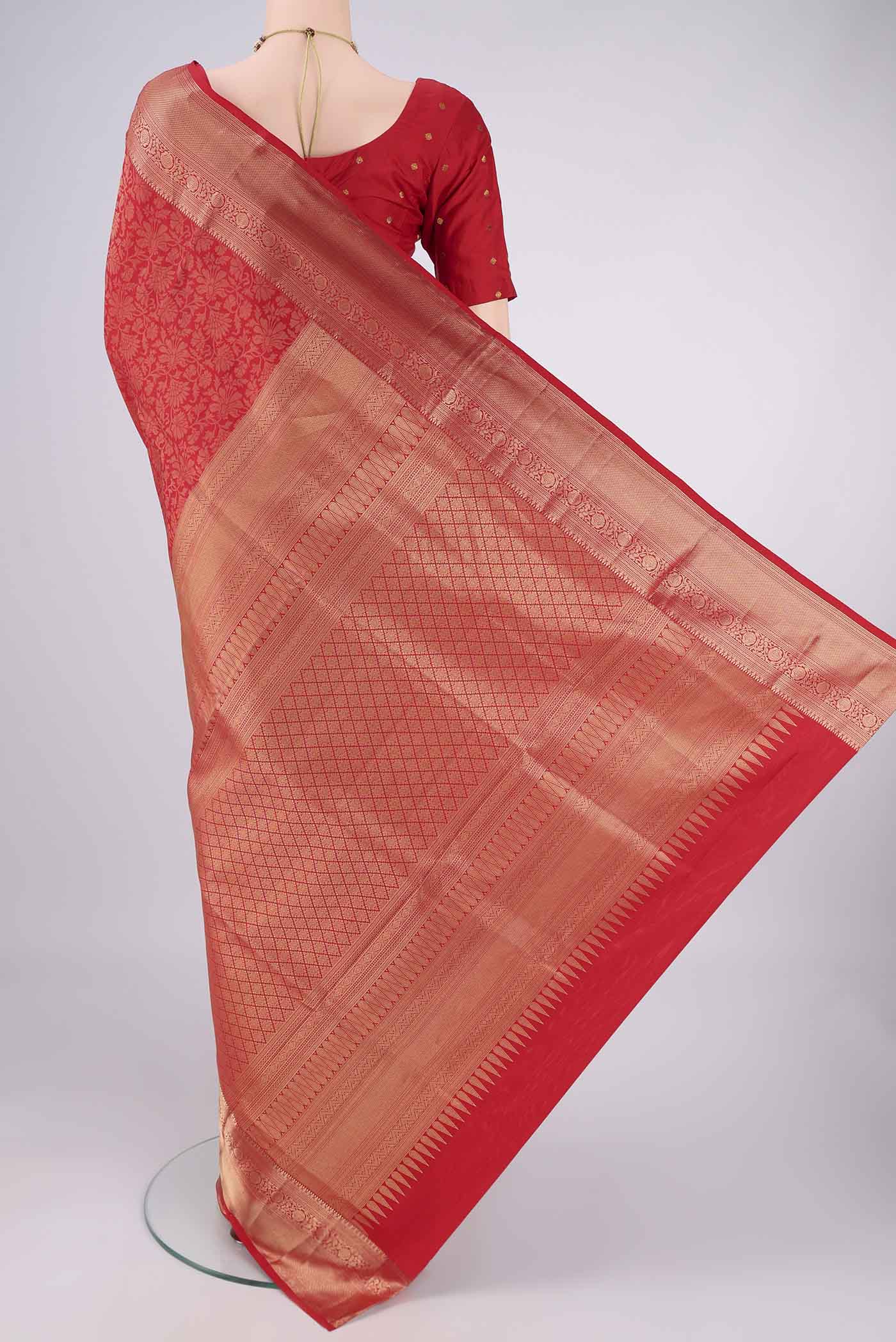 Flat view of Red Soft Silk Saree with Zari Brocade on the body and Zari Border. 
