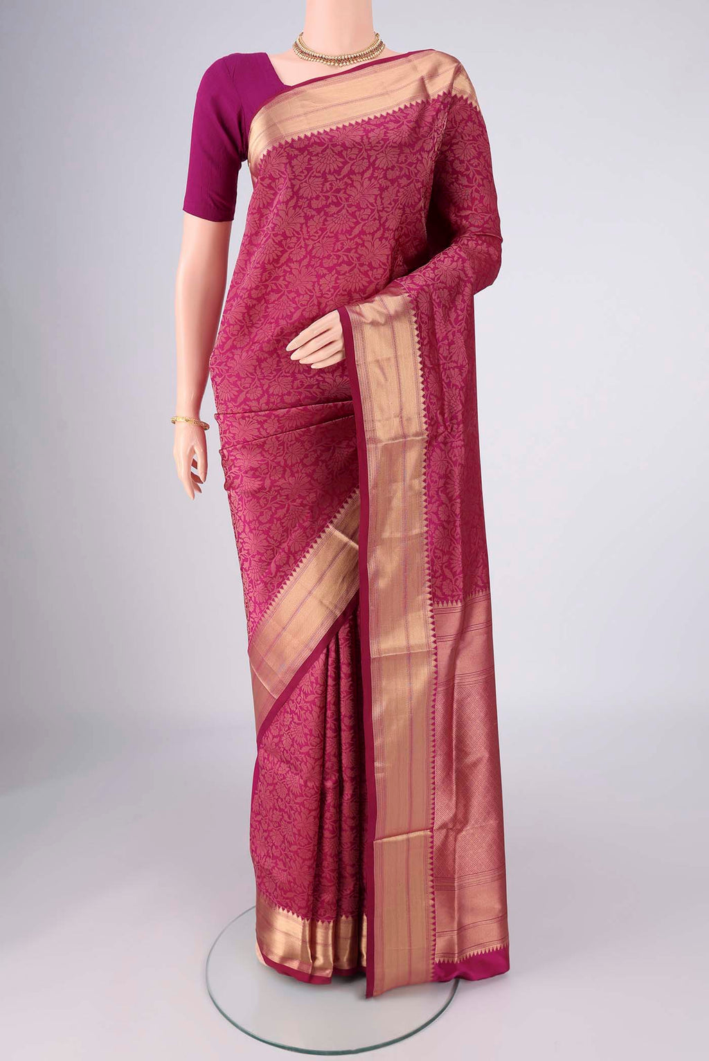 Magenta Soft Silk Saree with Zari Brocade on the body and Zari Border.  displayed on a mannequin